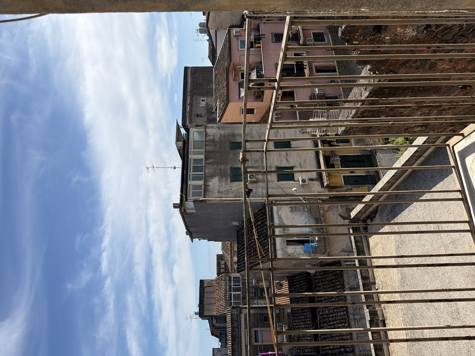 Urban balcony view documented in Catania, Italy