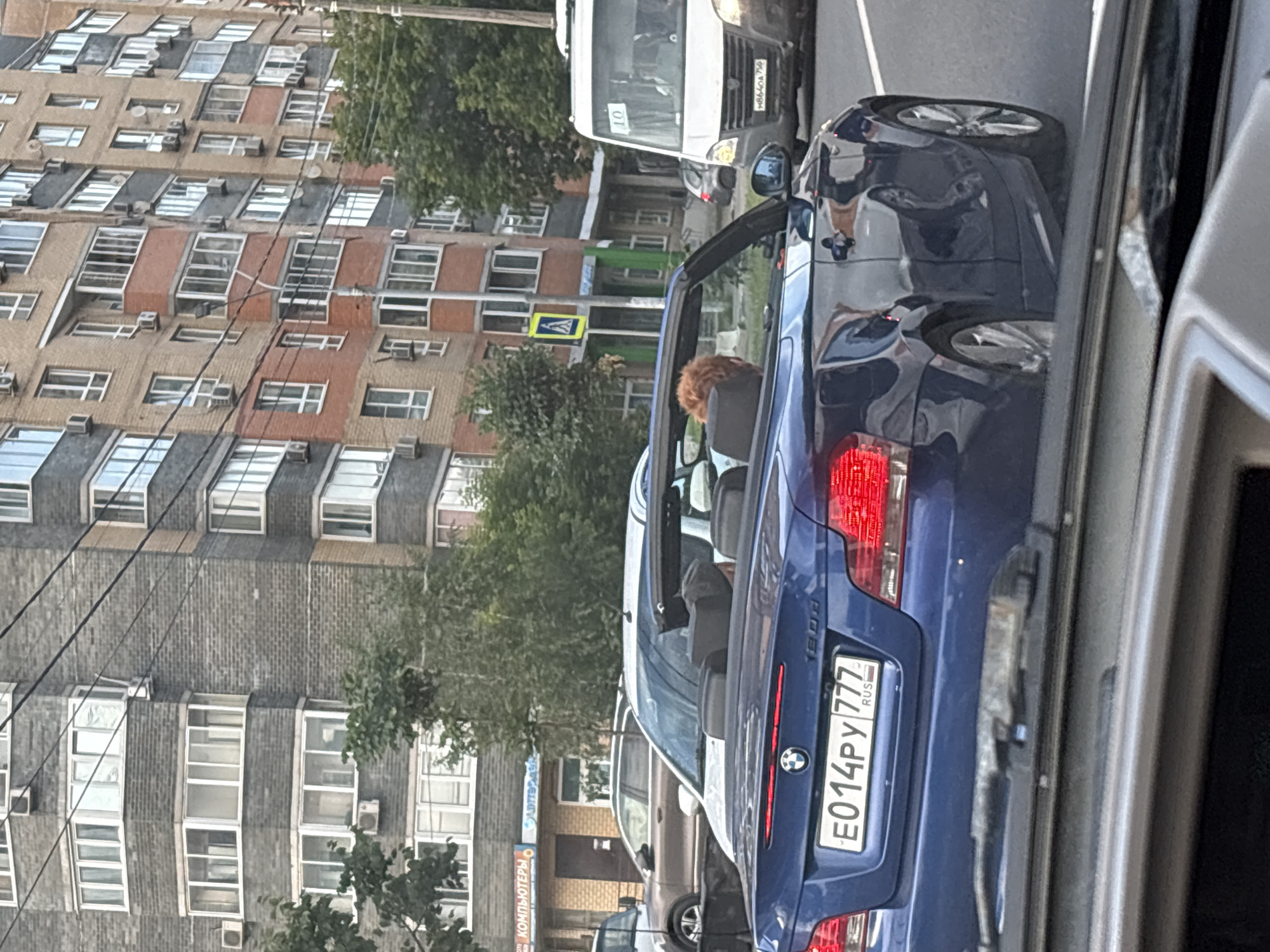 Cruising Mytishchi streets with convertibles and a dog in tow
