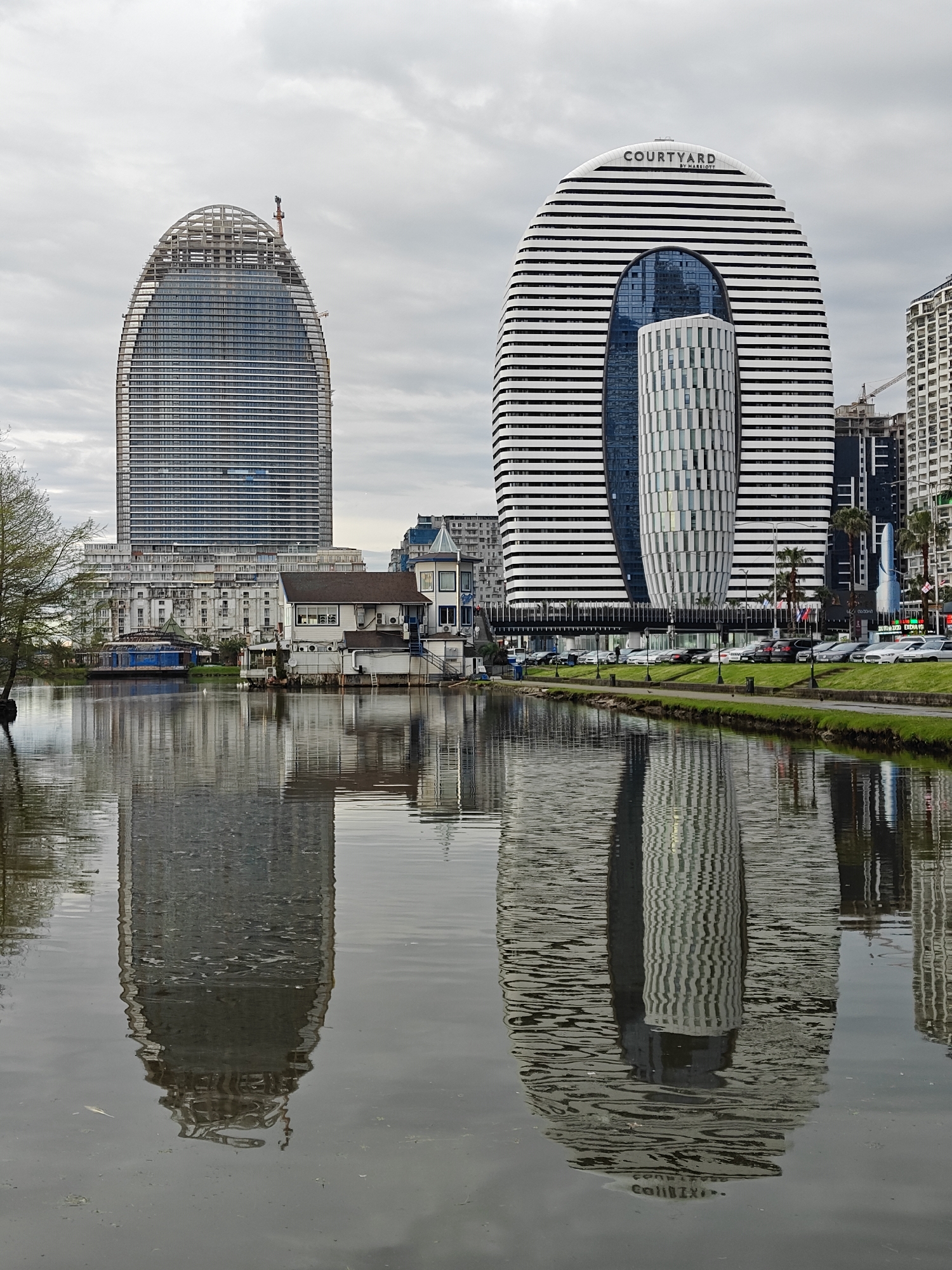 Urban witness documents modern city district with twin striped towers