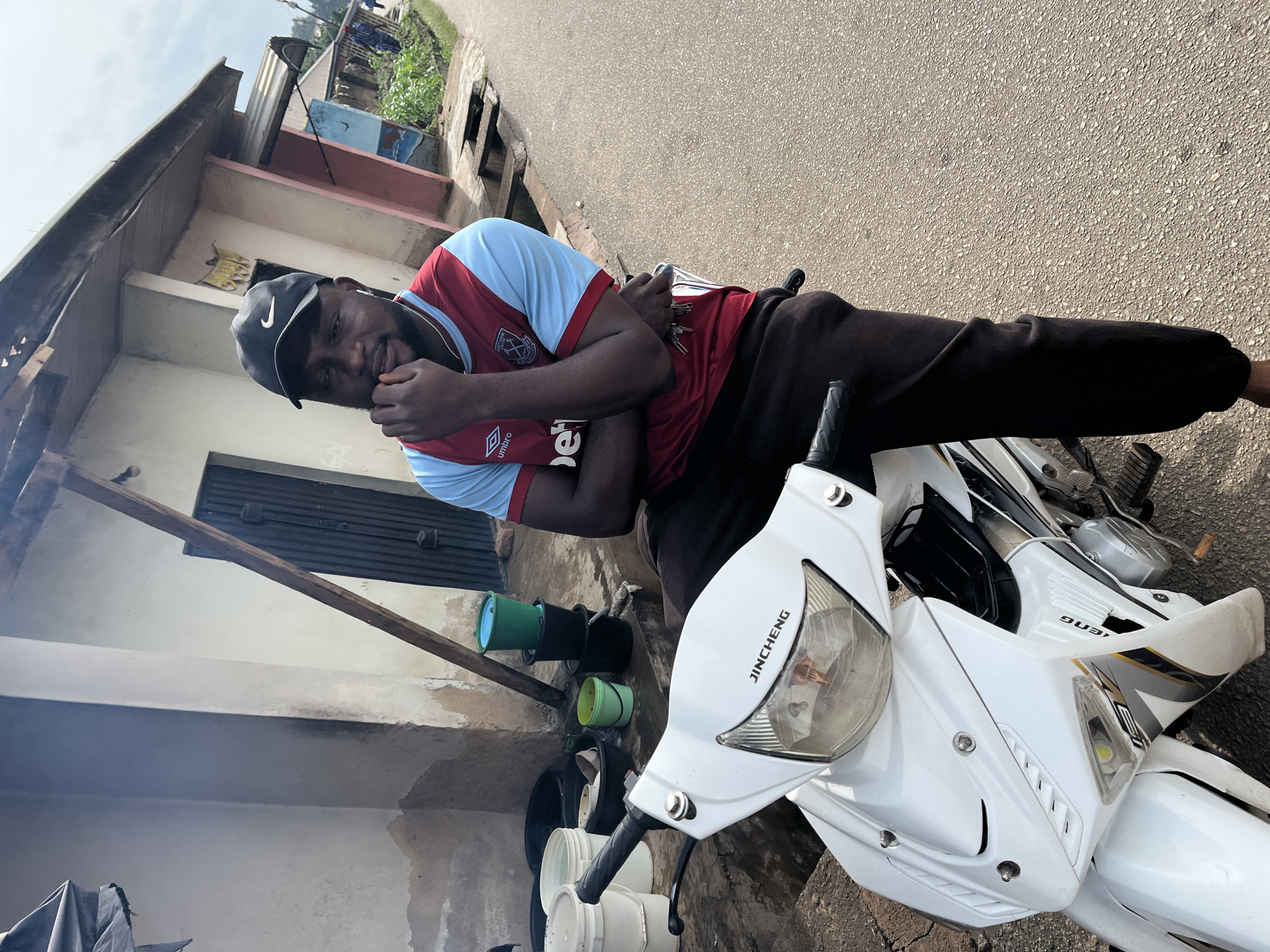 Casual morning in Jos, Nigeria — portraits, street scenes, and rocky landscape