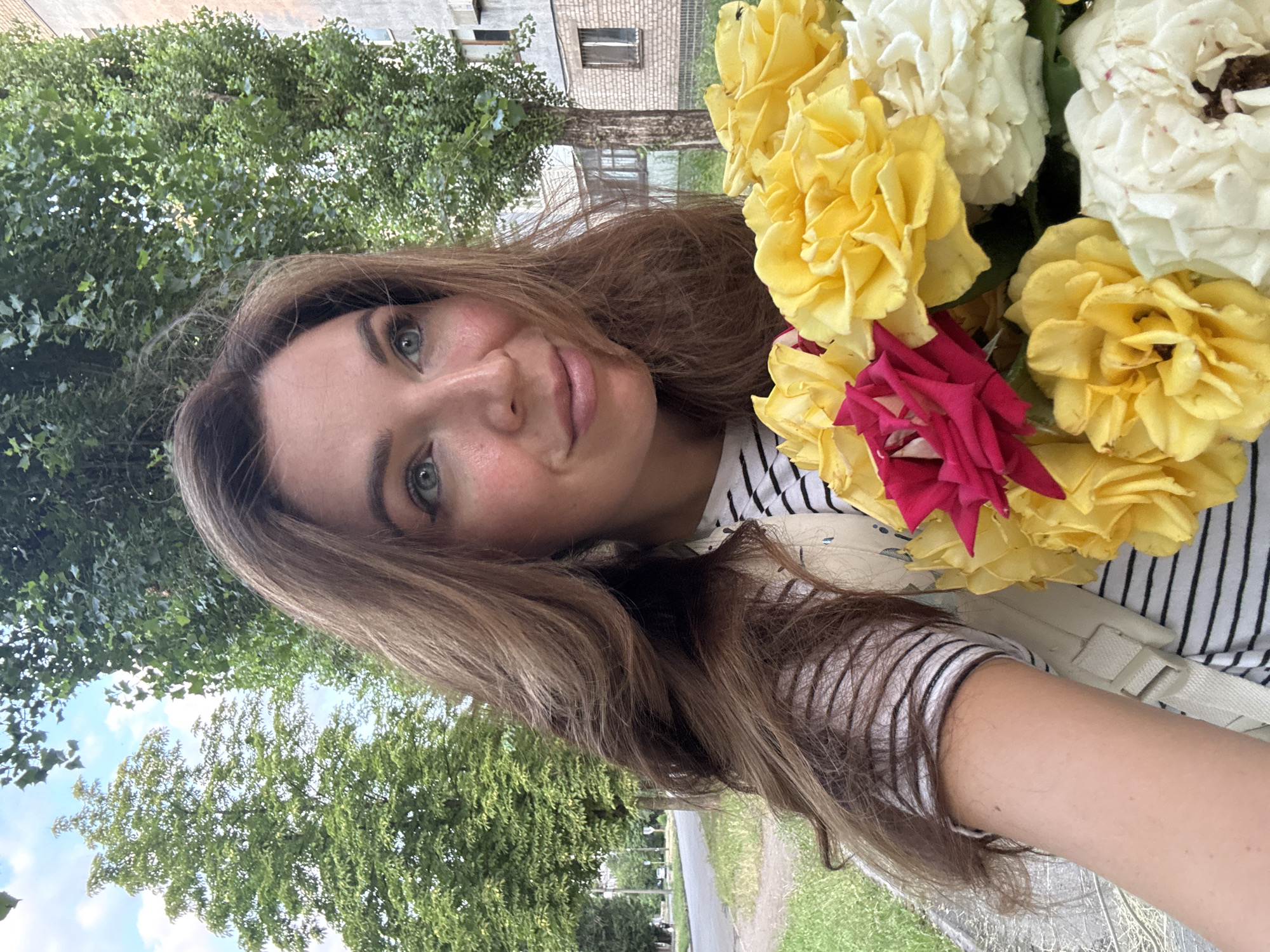 Roses and a roaming cat on a Kryvyi Rih afternoon