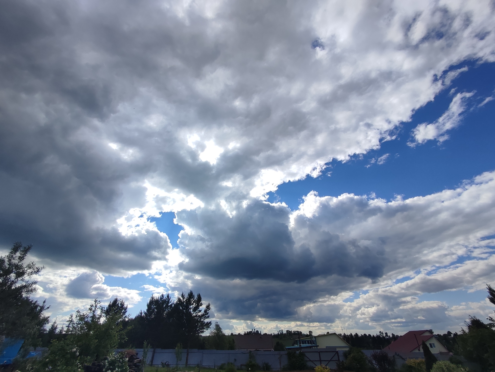 Outdoor portrait session amid storm clouds in Fokino, Russia