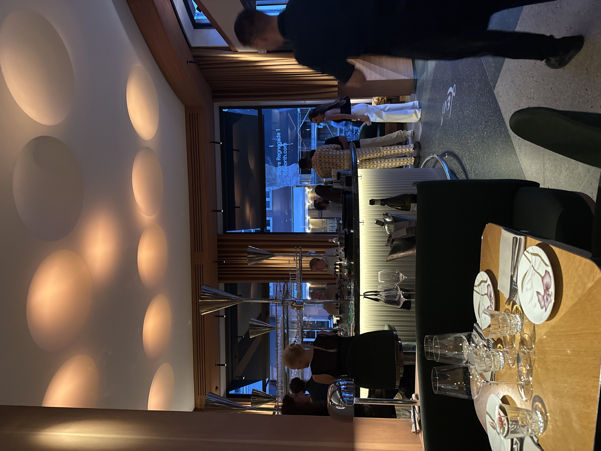 Cocktails and conversation at a busy restaurant table