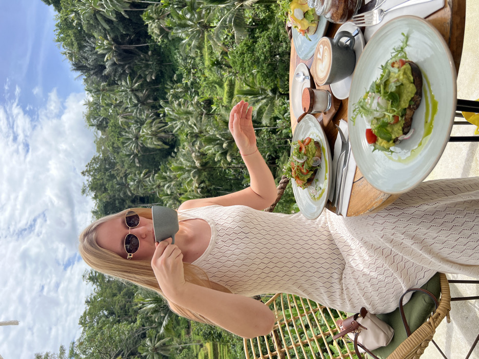 Tourist enjoys brunch overlooking rice terraces in Tegal Suci
