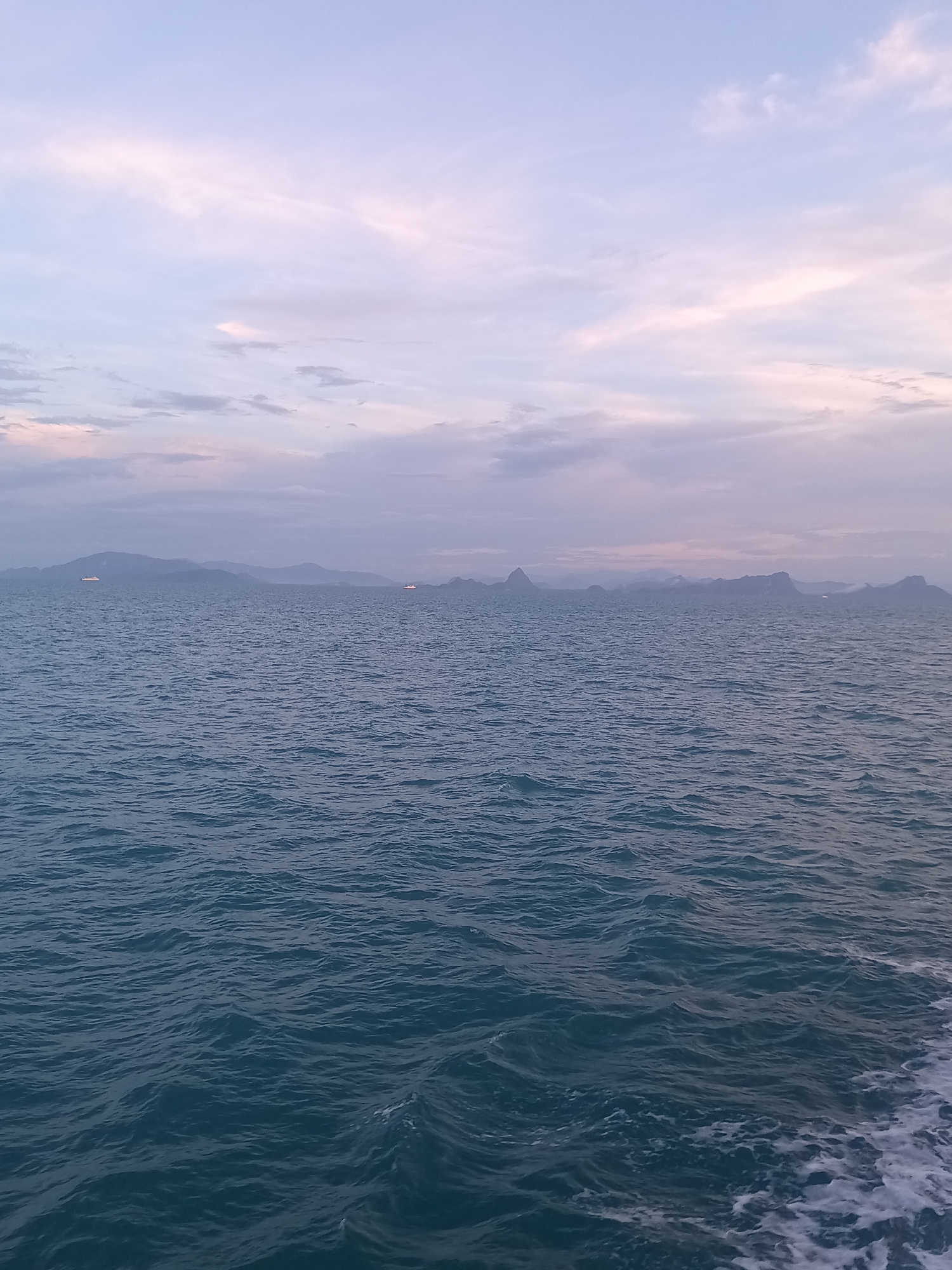 Ferry passenger documents ocean journey near Thai coast