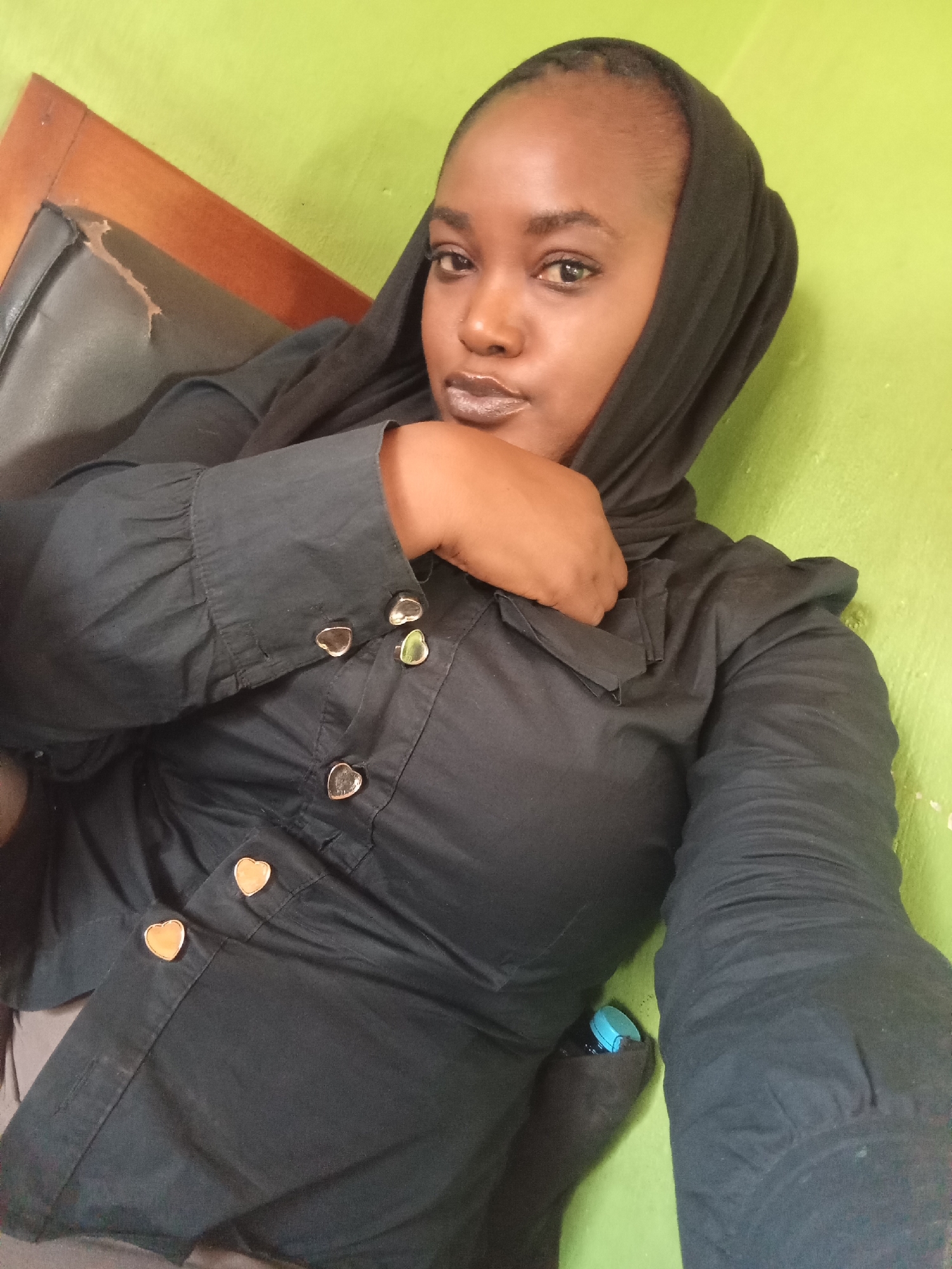 Woman photographed in portrait at Nigerian stadium