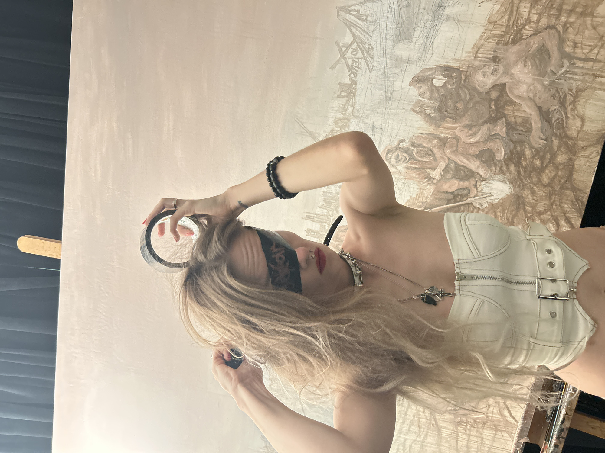 Blindfolded woman with tape documented during art session in Cape Coral
