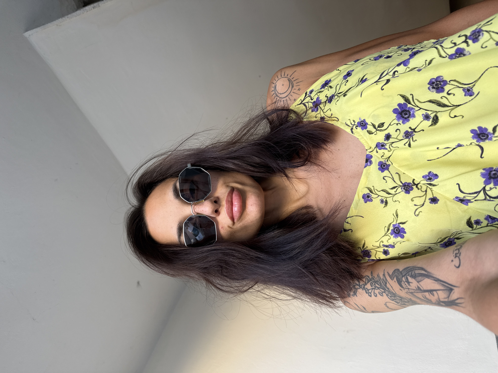 Woman in yellow dress photographed at multiple Pleven locations