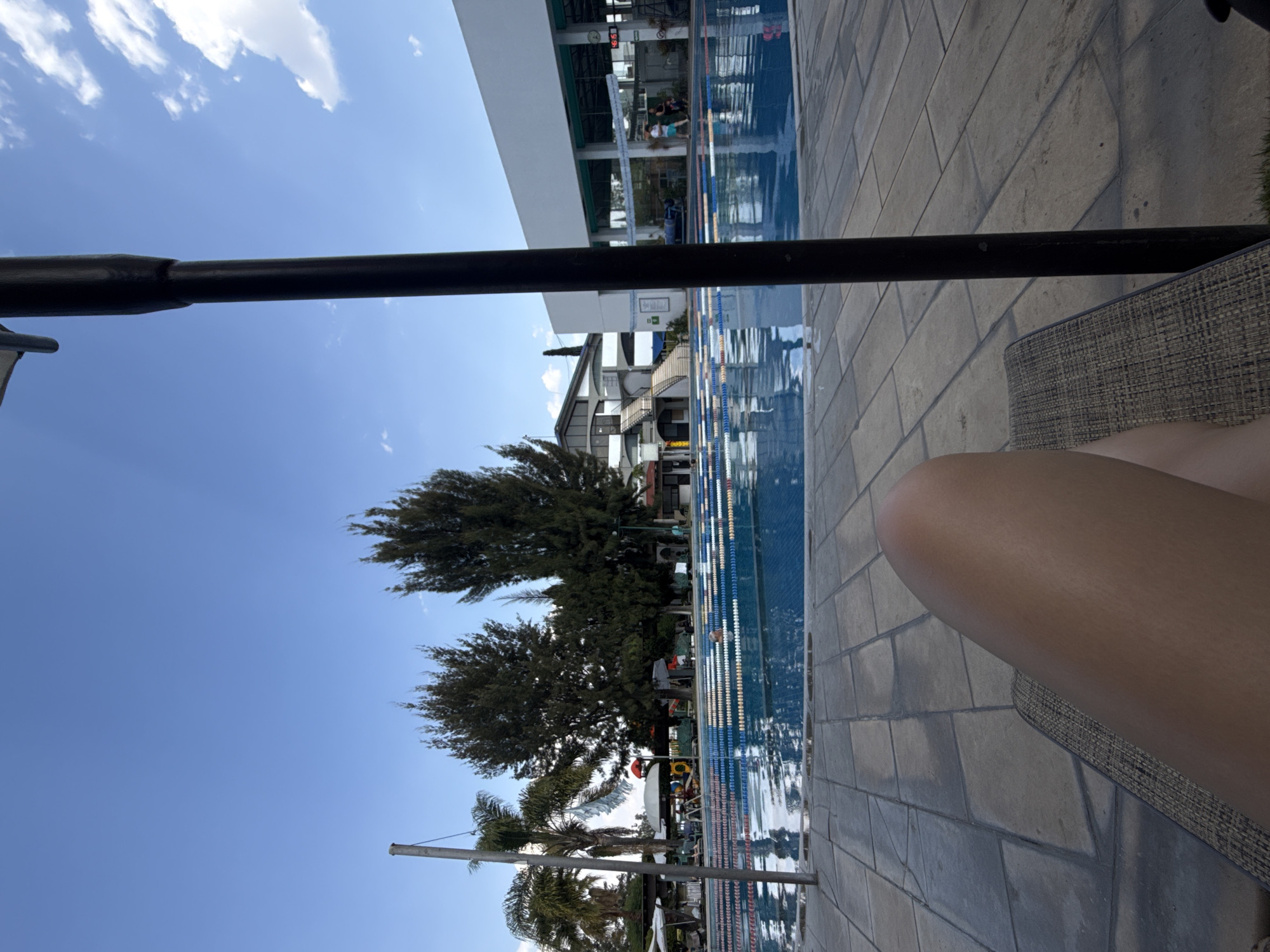 Evening poolside dining and recreation documented at sports facility
