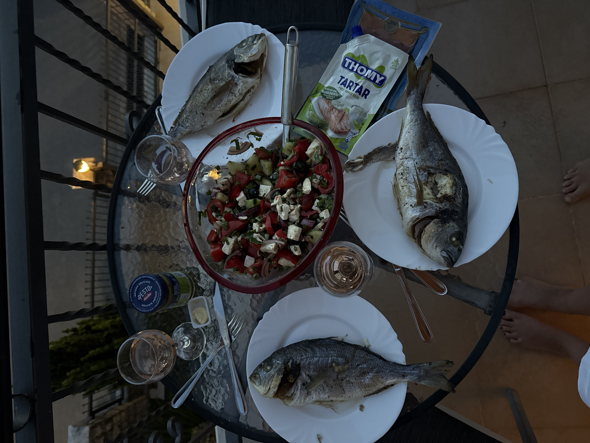 Evening fish dinner served on balcony in Tivat, Montenegro