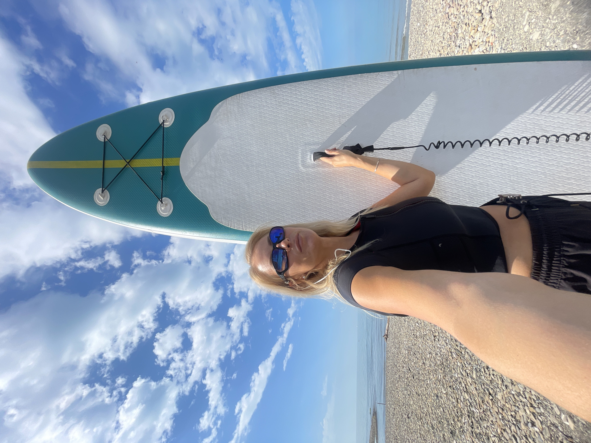 Woman with paddleboard spotted on Russian beach early morning