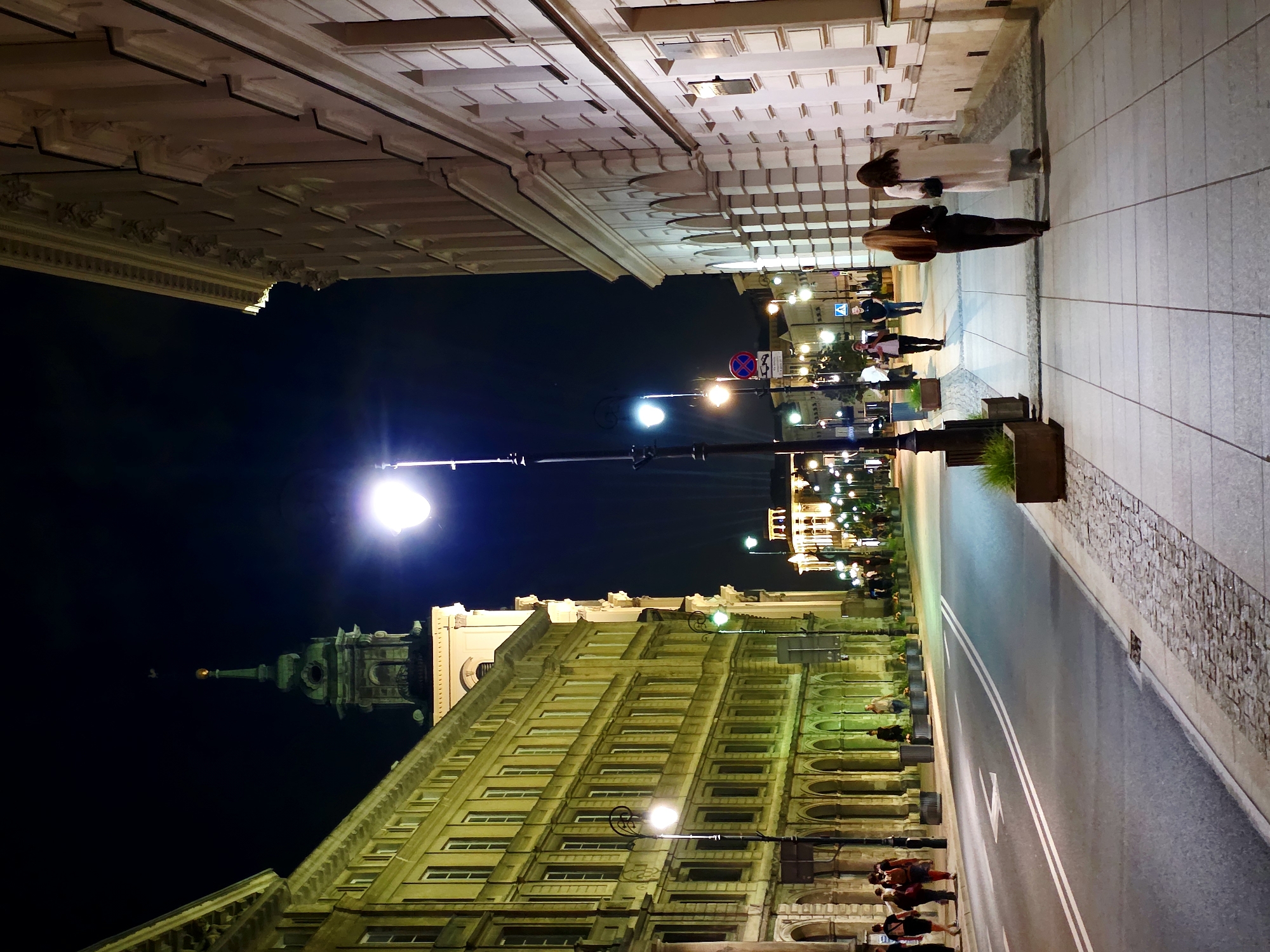 Late evening along Warsaw's Royal Route, lit-up streets and landmarks