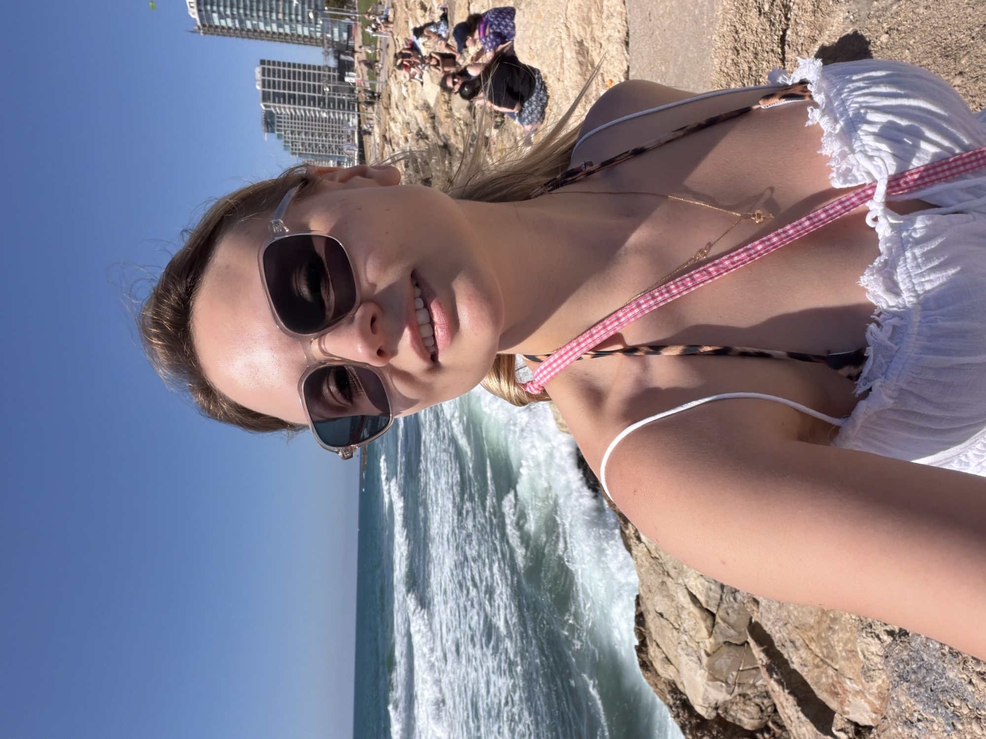 Woman photographed on Tel Aviv cliff overlooking Mediterranean Sea