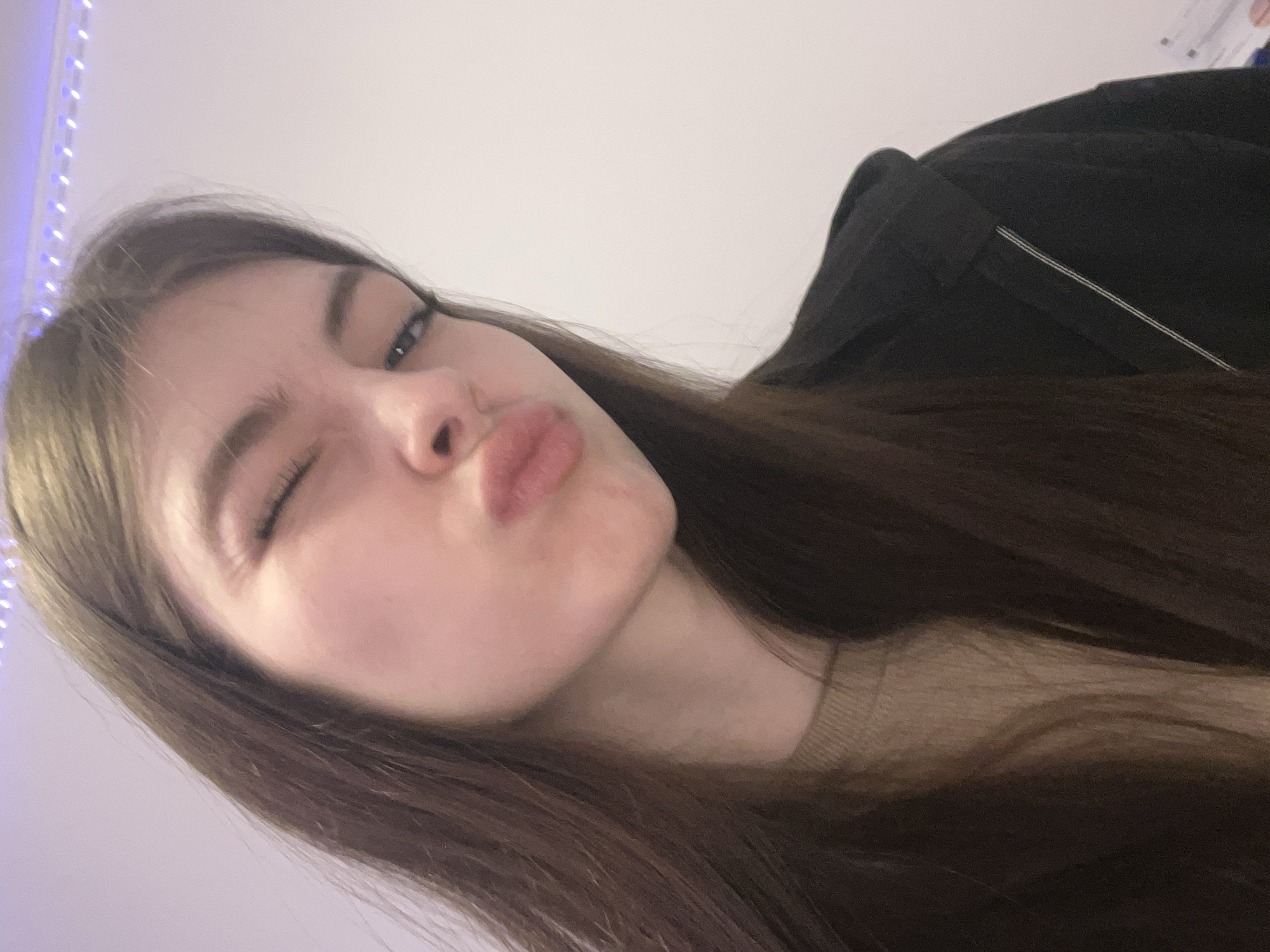 Young woman documents daily life through selfies in Saint Petersburg