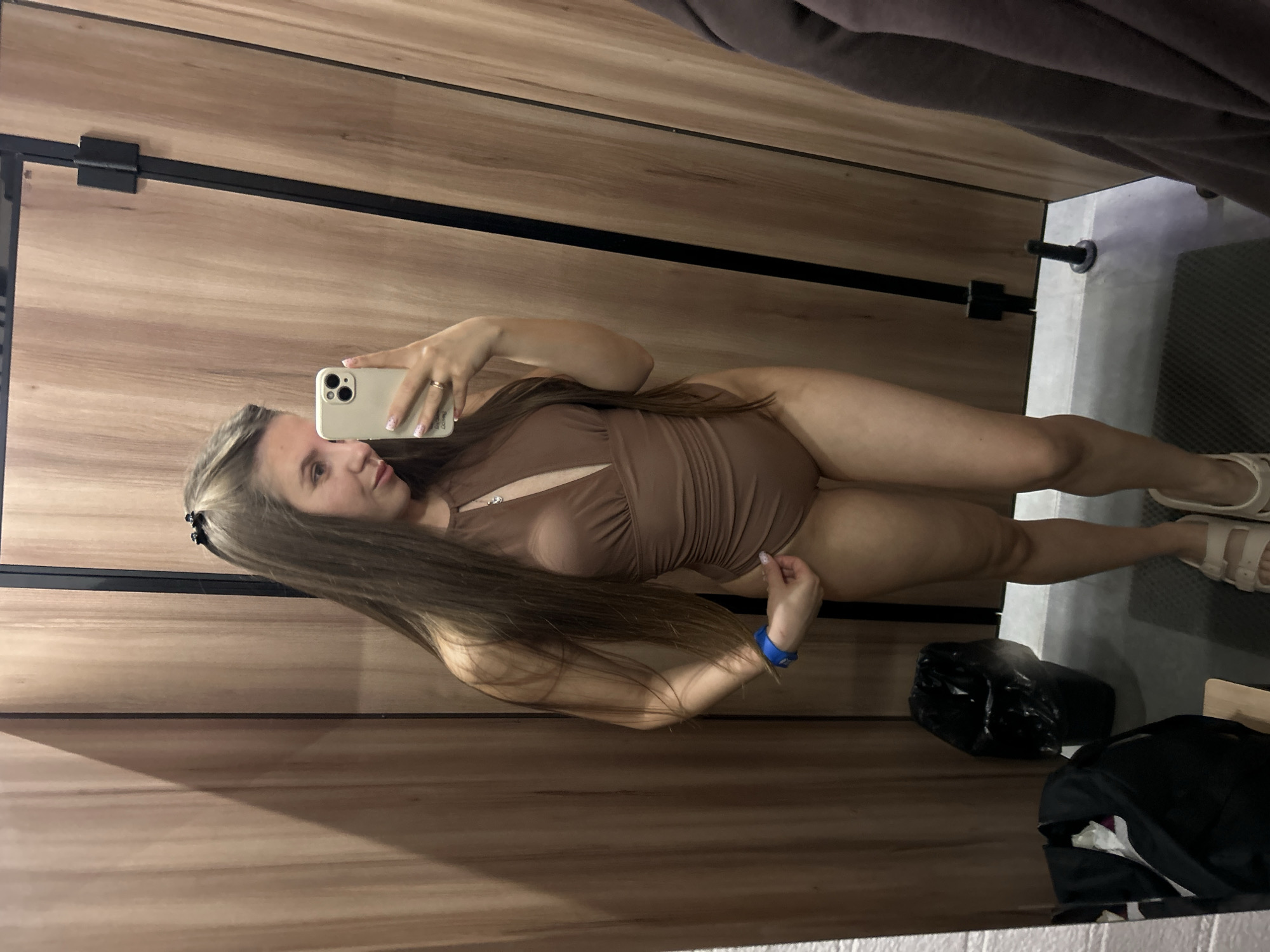Woman takes mirror selfies in Tver fitting room