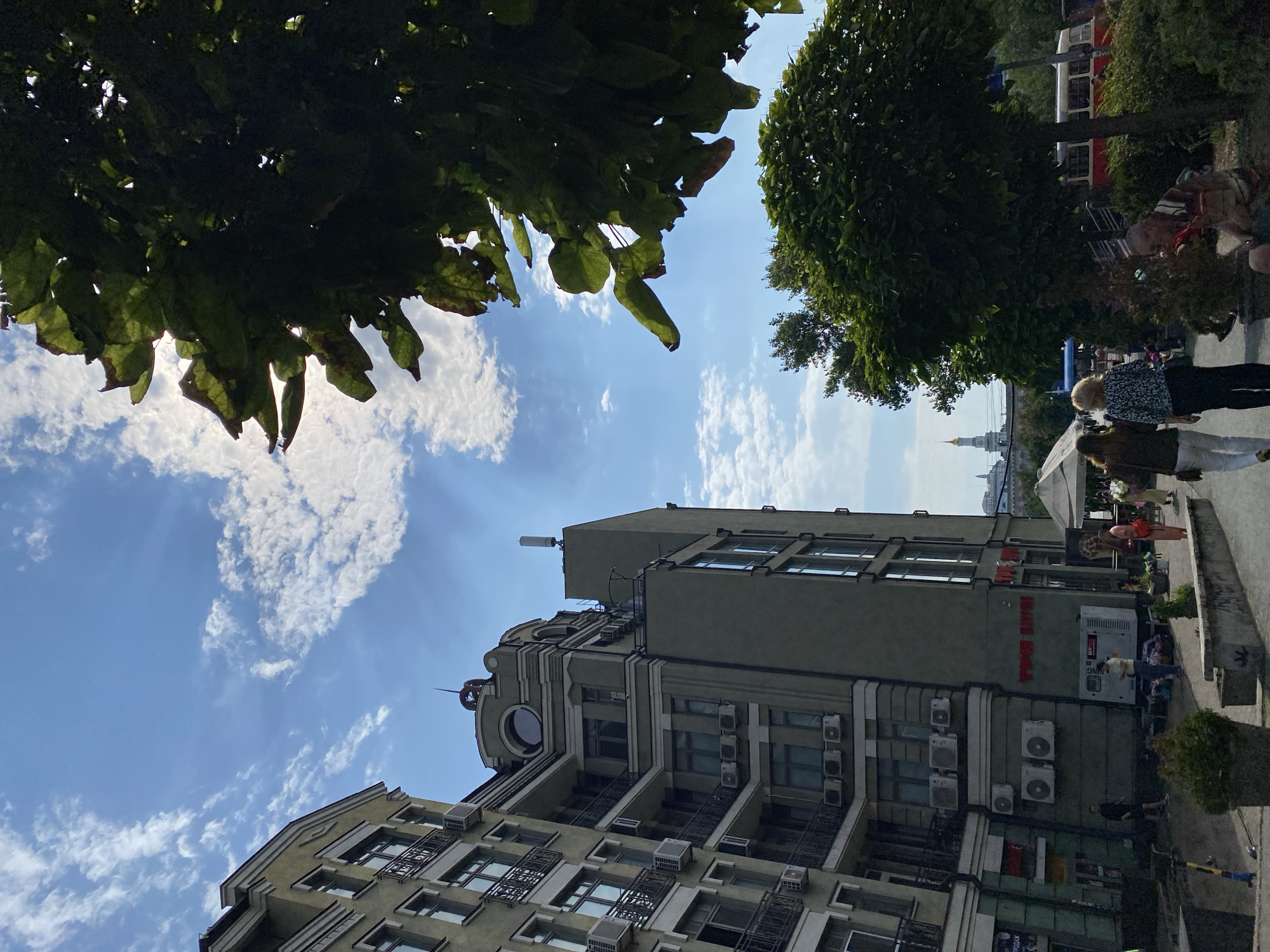 Morning stroll through a city center with public art and neoclassical architecture