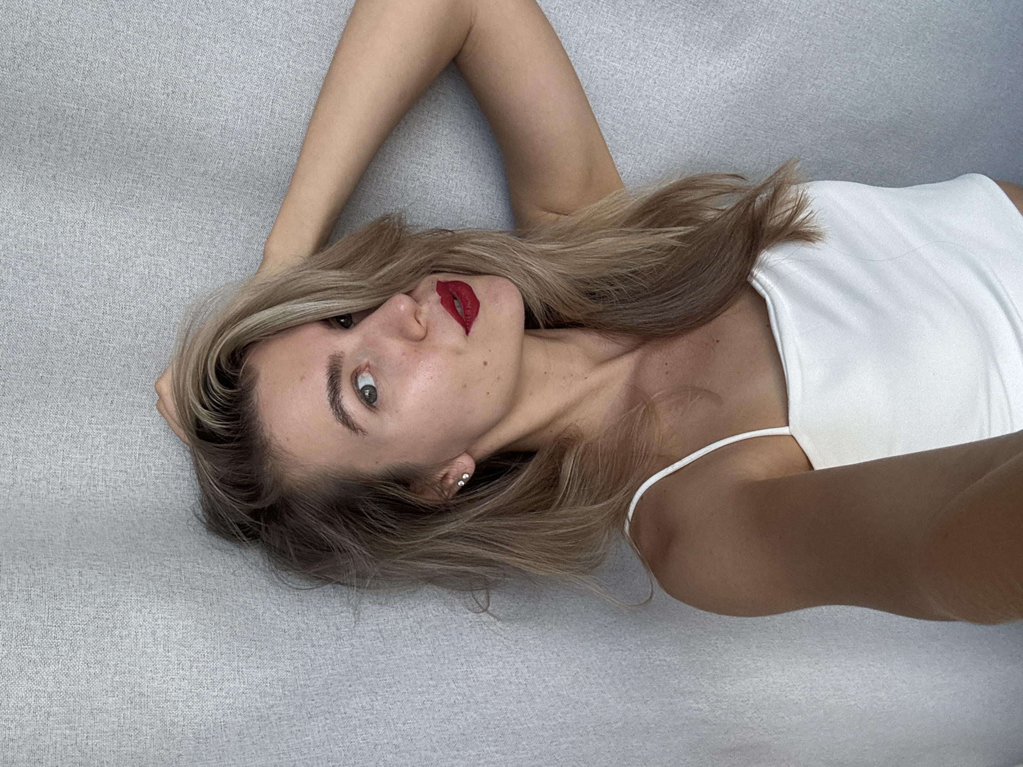 Woman photographed with cat in indoor portrait session