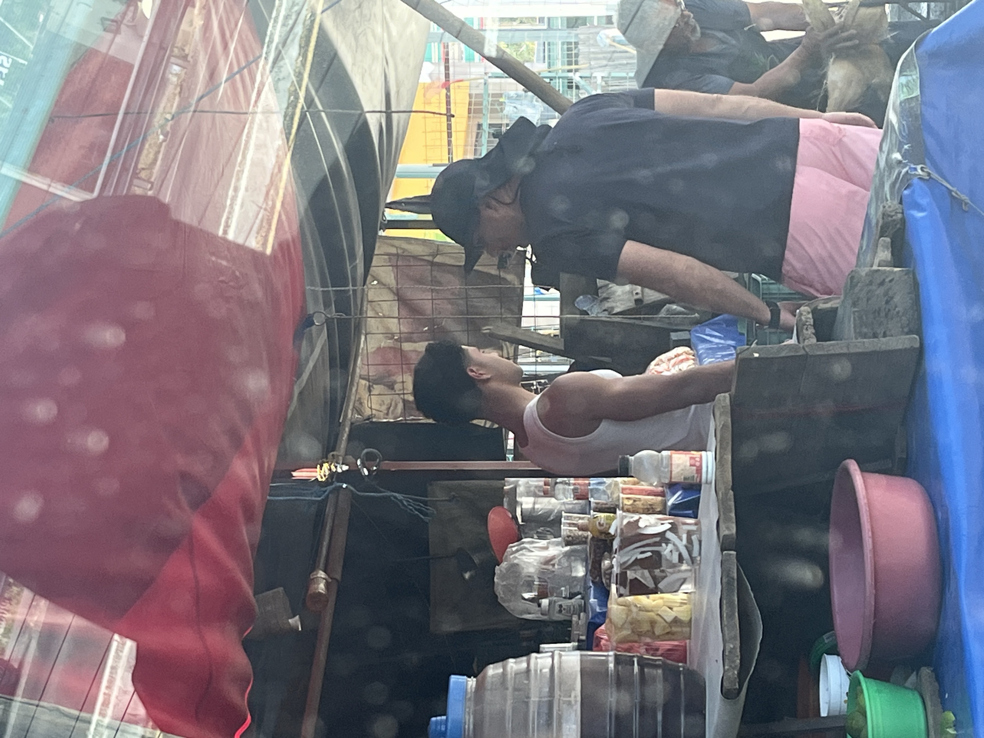 Roadside pineapple vendor serves customer in San Juan Huiluco