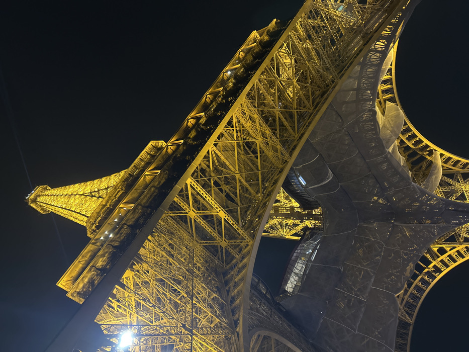 Eiffel Tower captured illuminated against dark Paris sky