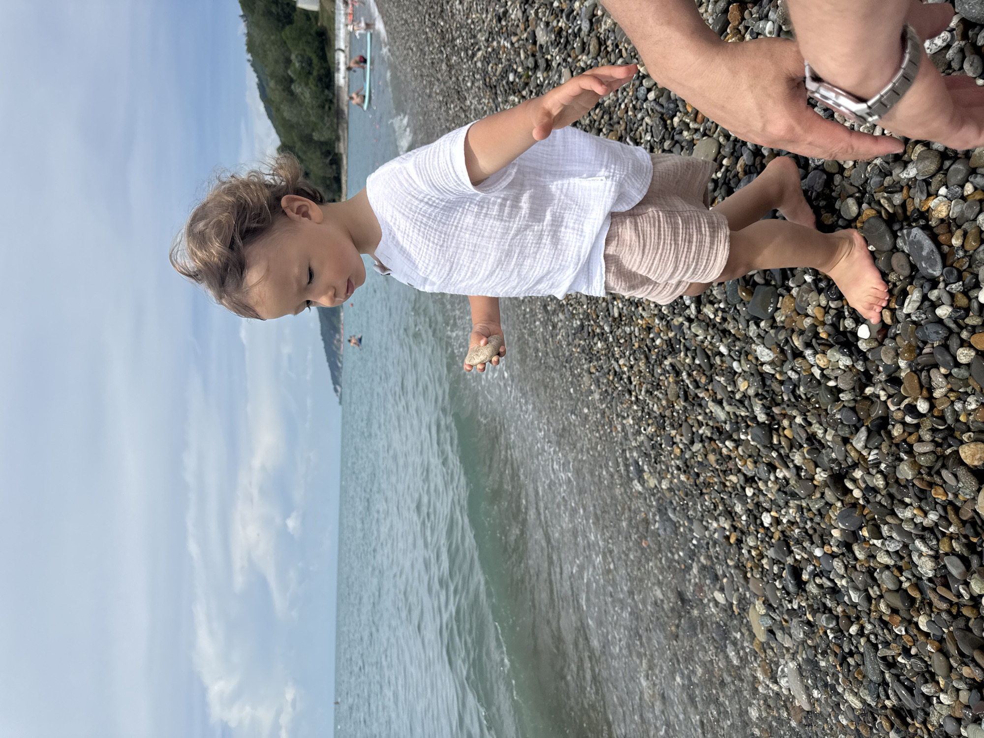 Family beach time and stone collecting in Sochi