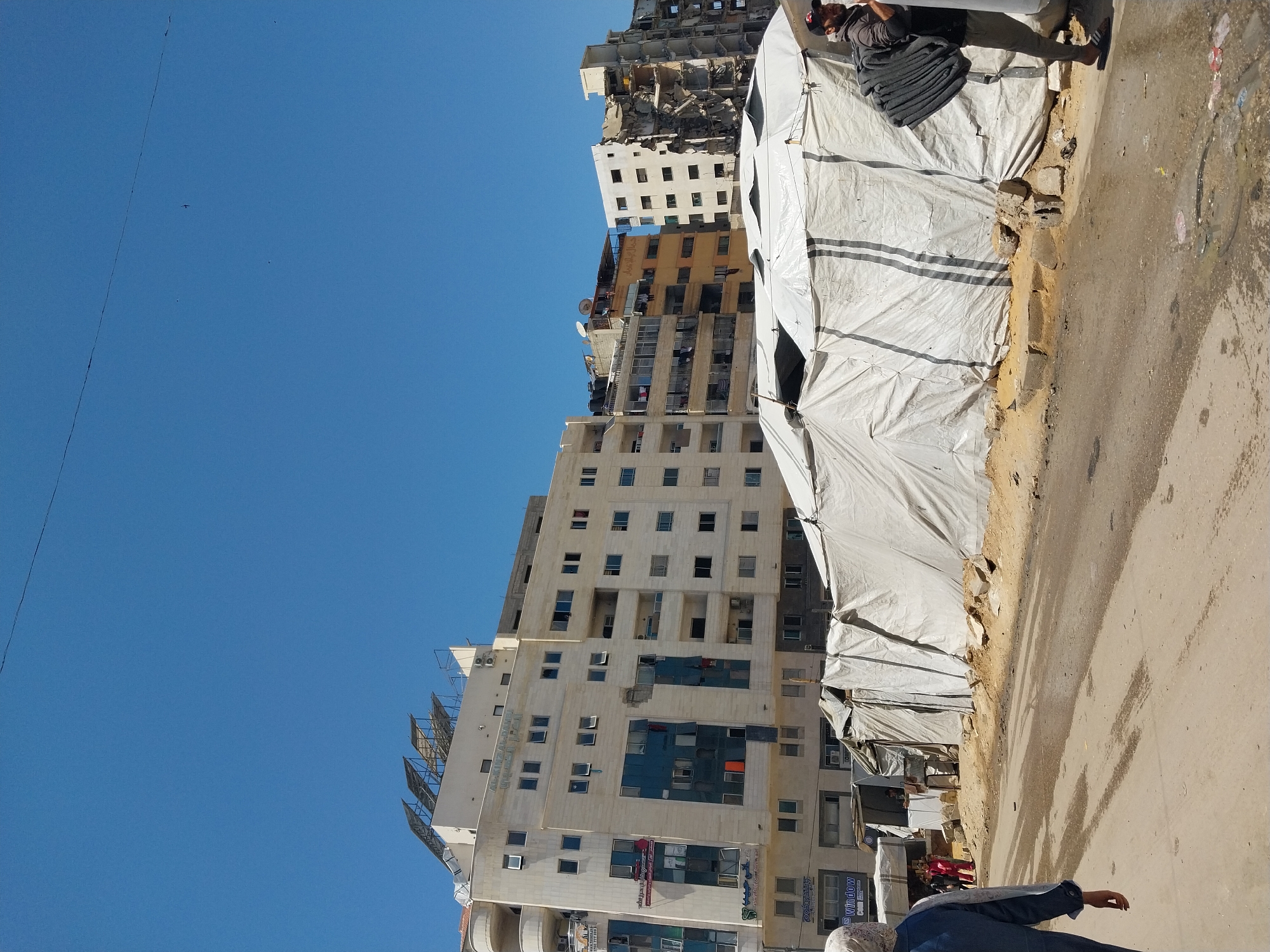 Damaged buildings and tents observed in Deir el-Balah