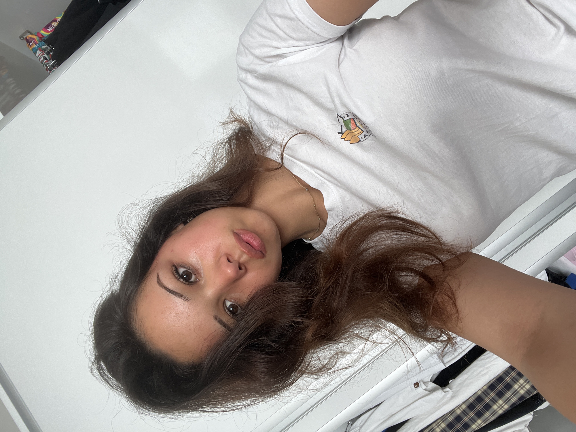 Woman takes morning selfies in bedroom in Zlatograd, Bulgaria