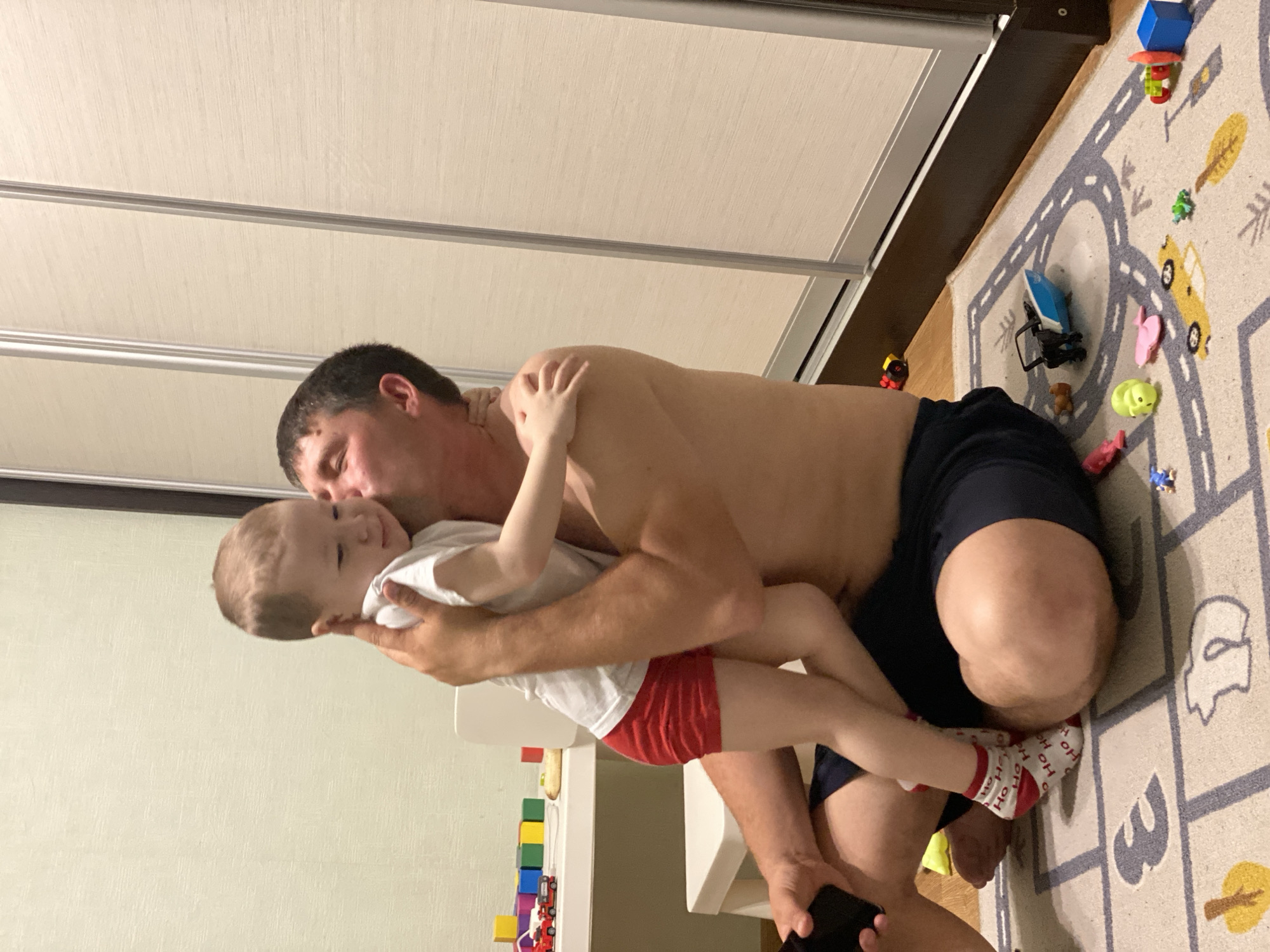 Father and child enjoy playtime in Sochi home