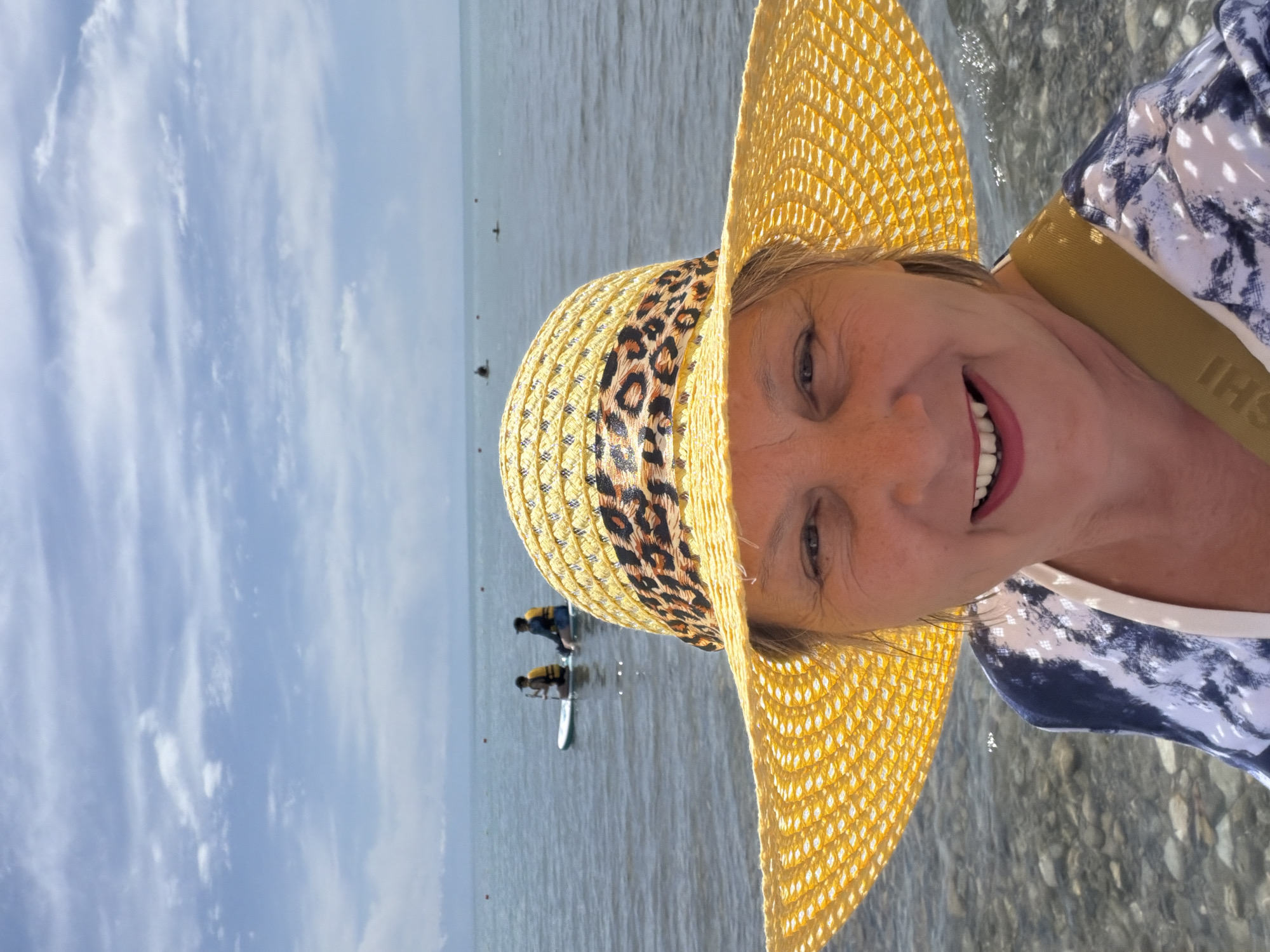A relaxed day on the water with paddleboards, inflatables, and swimmers