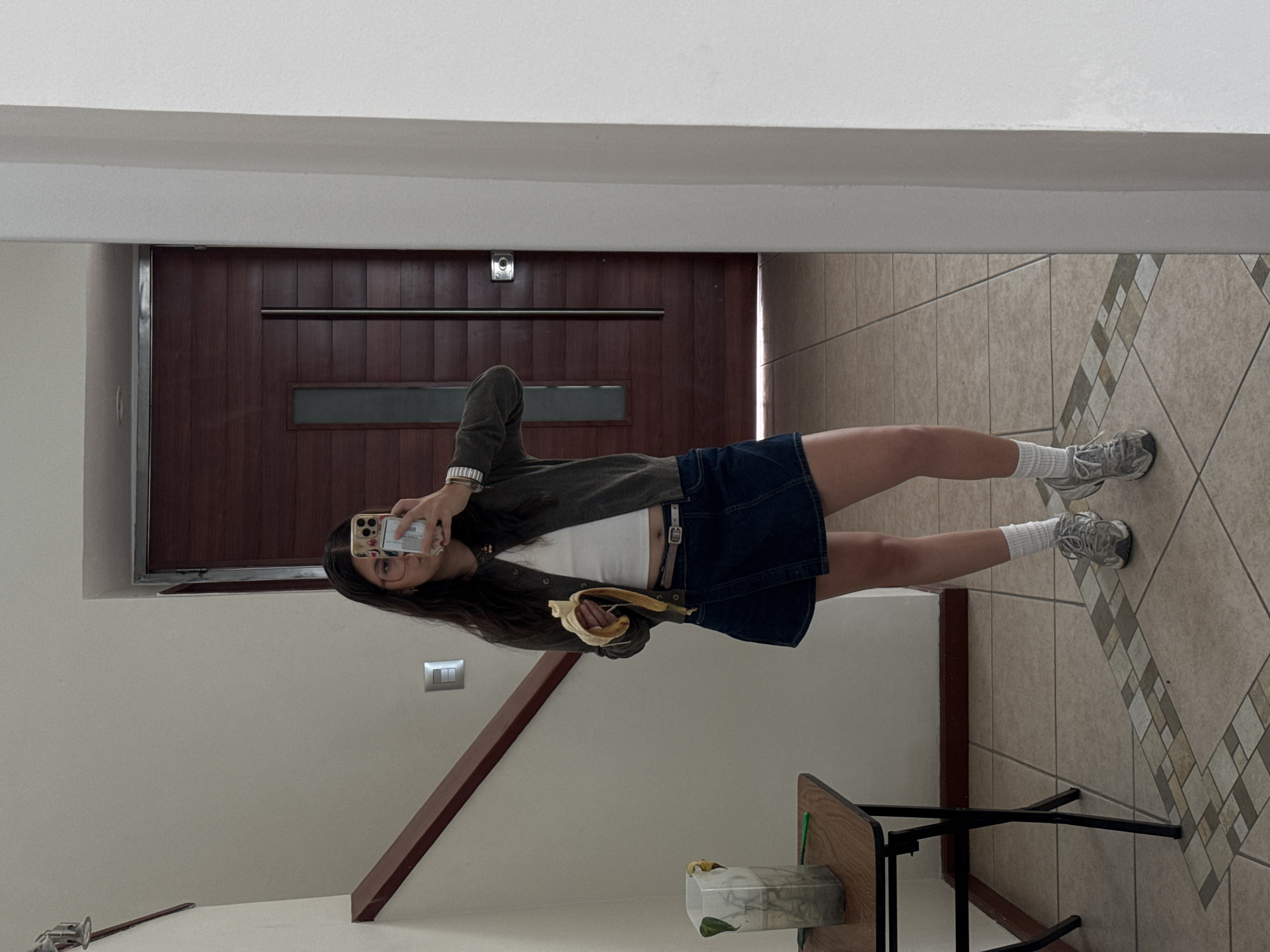 Woman takes mirror selfies indoors in Puebla, Mexico