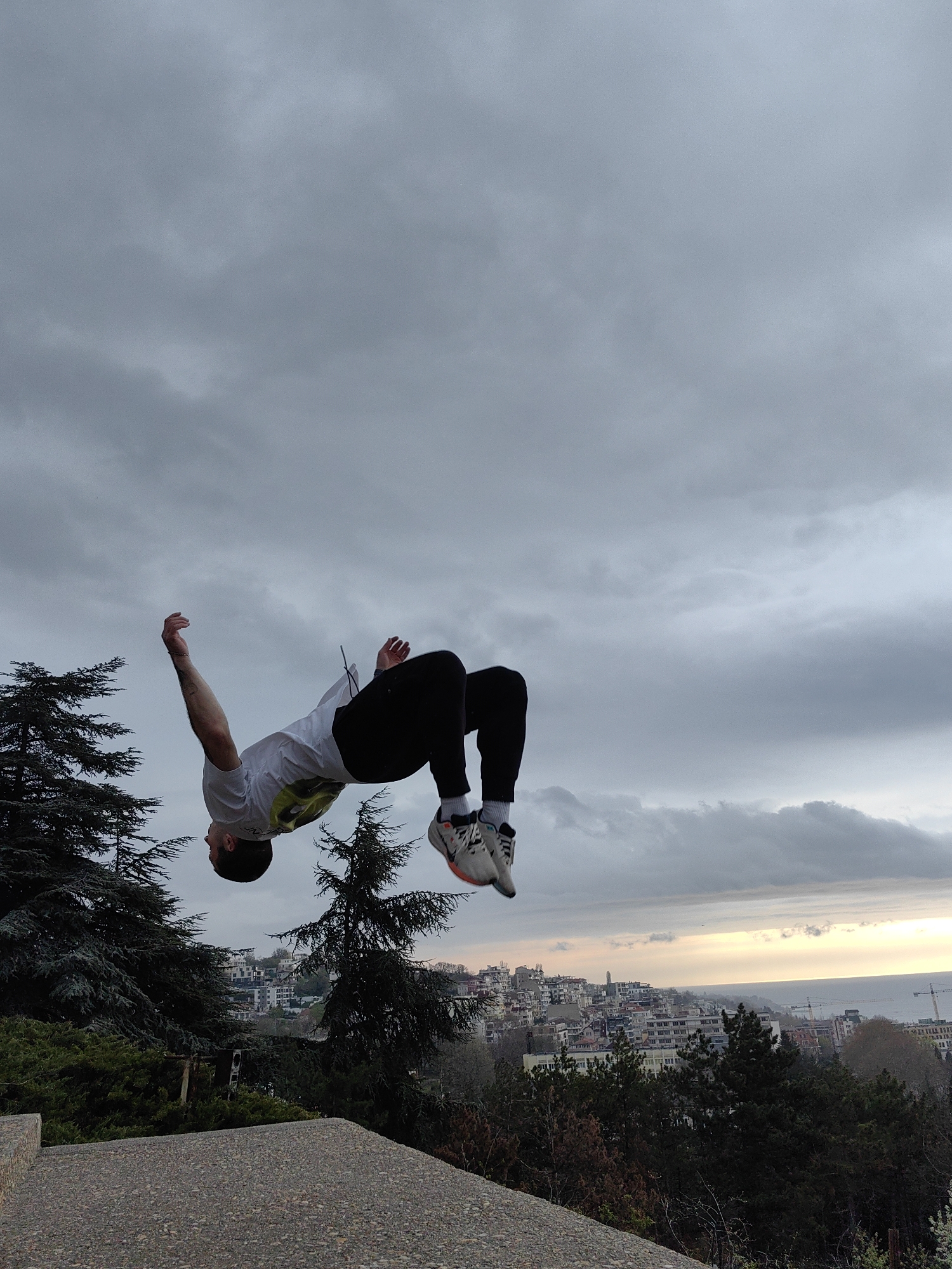 Man performs morning backflips on concrete structure in Varna