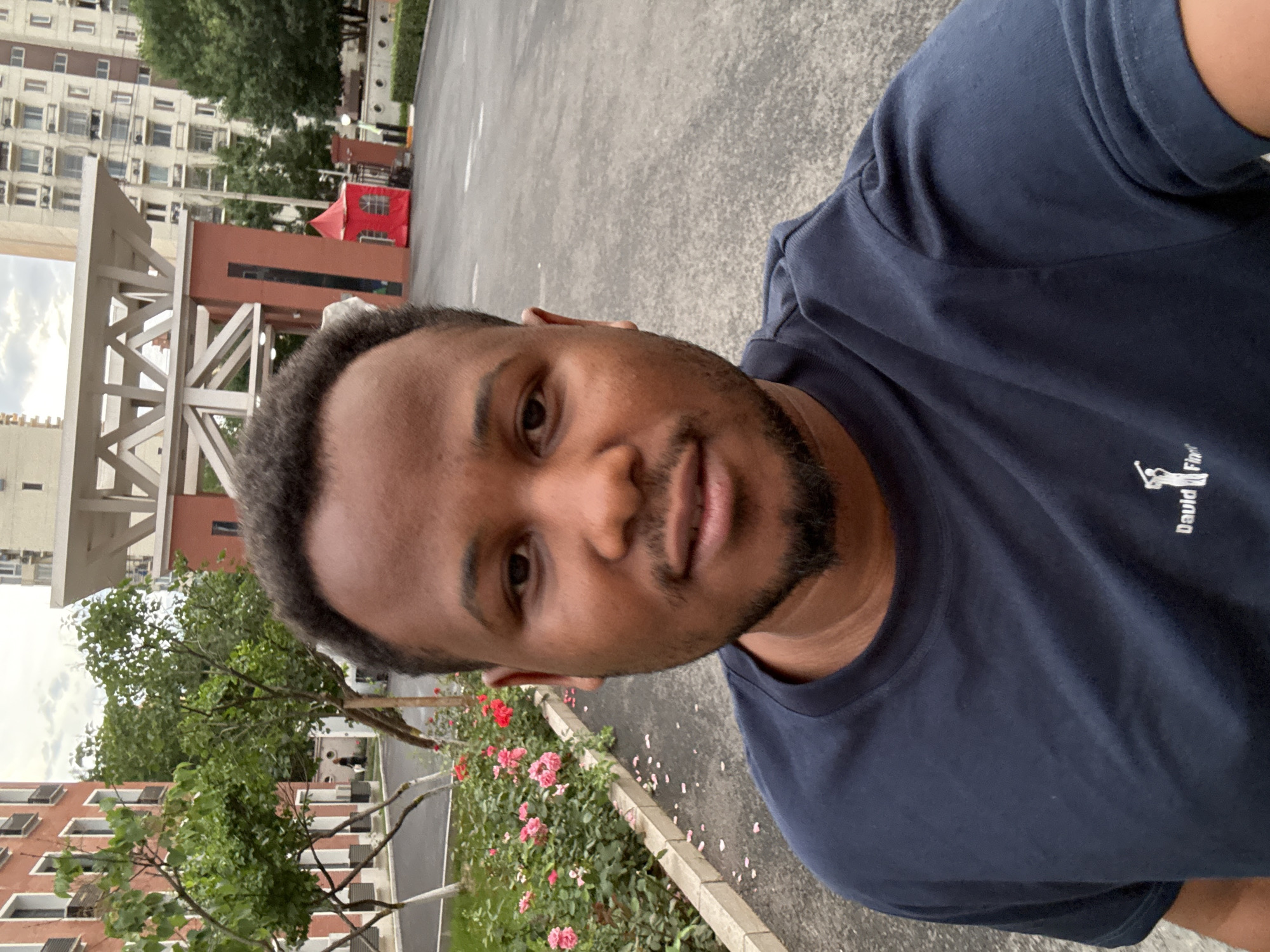 Standing outside red brick building in Beijing's Daxing District