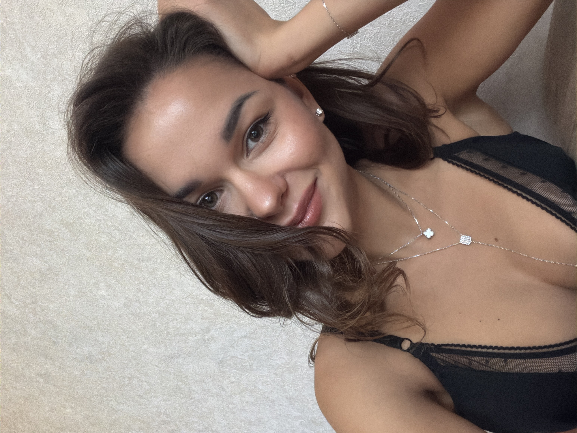 Woman takes mirror selfie in Krasnoyarsk room