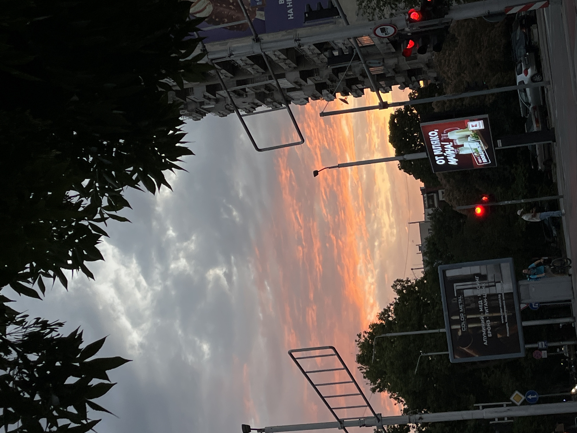 Dusk hits Plovdiv streets near a McDonald's after rain