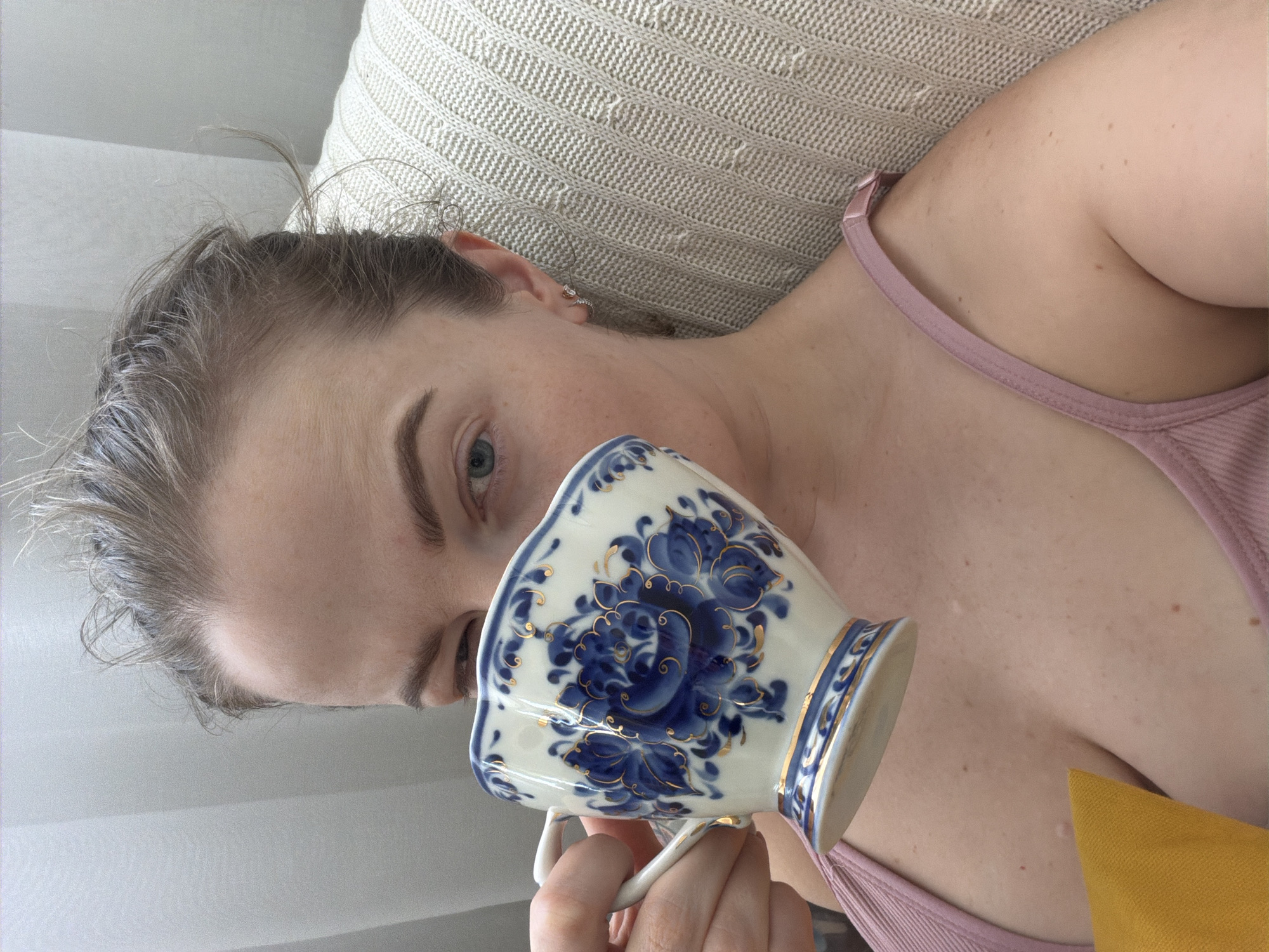 Person enjoys traditional tea moment indoors in Moscow
