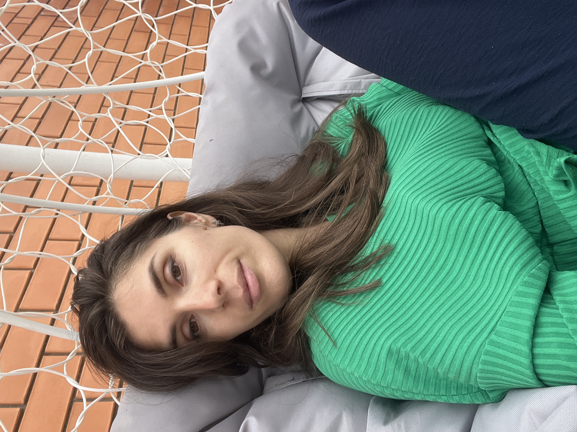 Woman relaxes in hammock chair in Kaspiysk, Russia