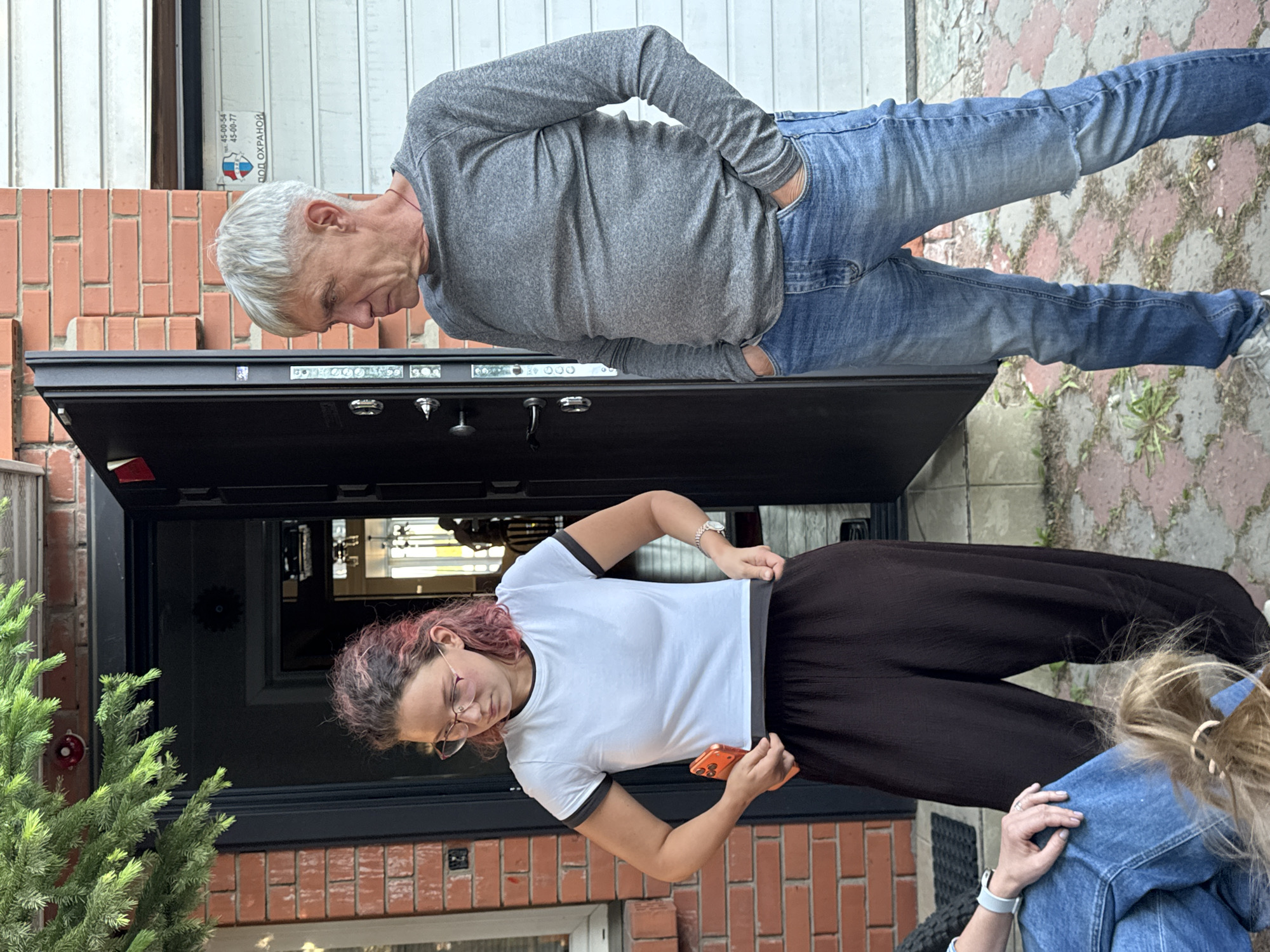 Family gathering with child and pug in Irkutsk residential area