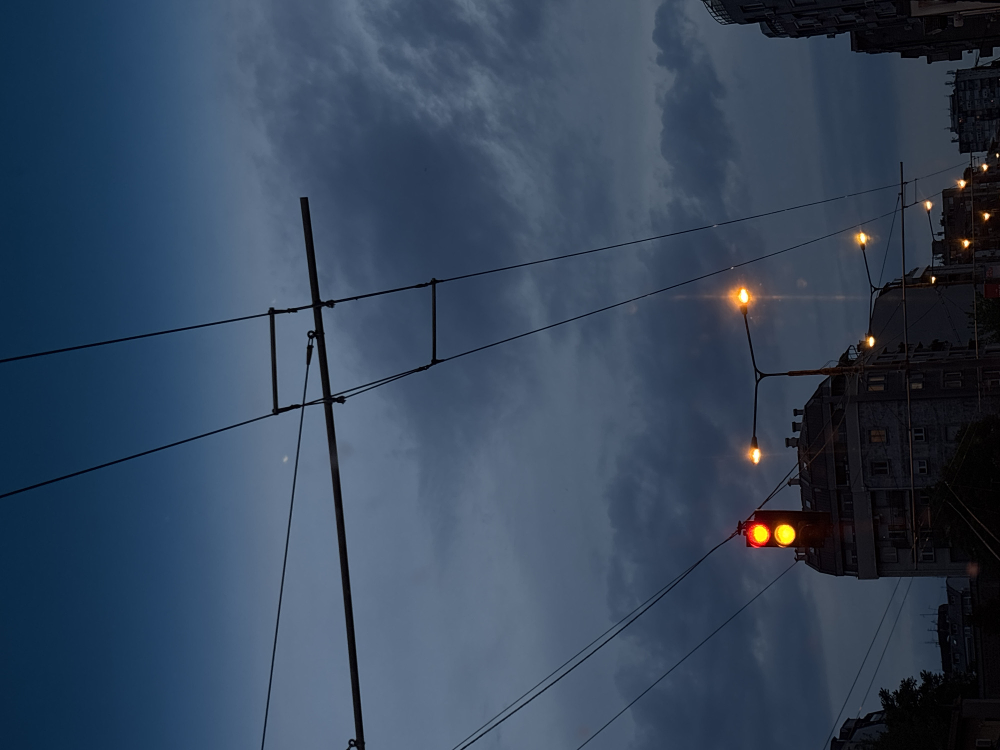 Evening traffic scene documented in Belgrade under cloudy skies