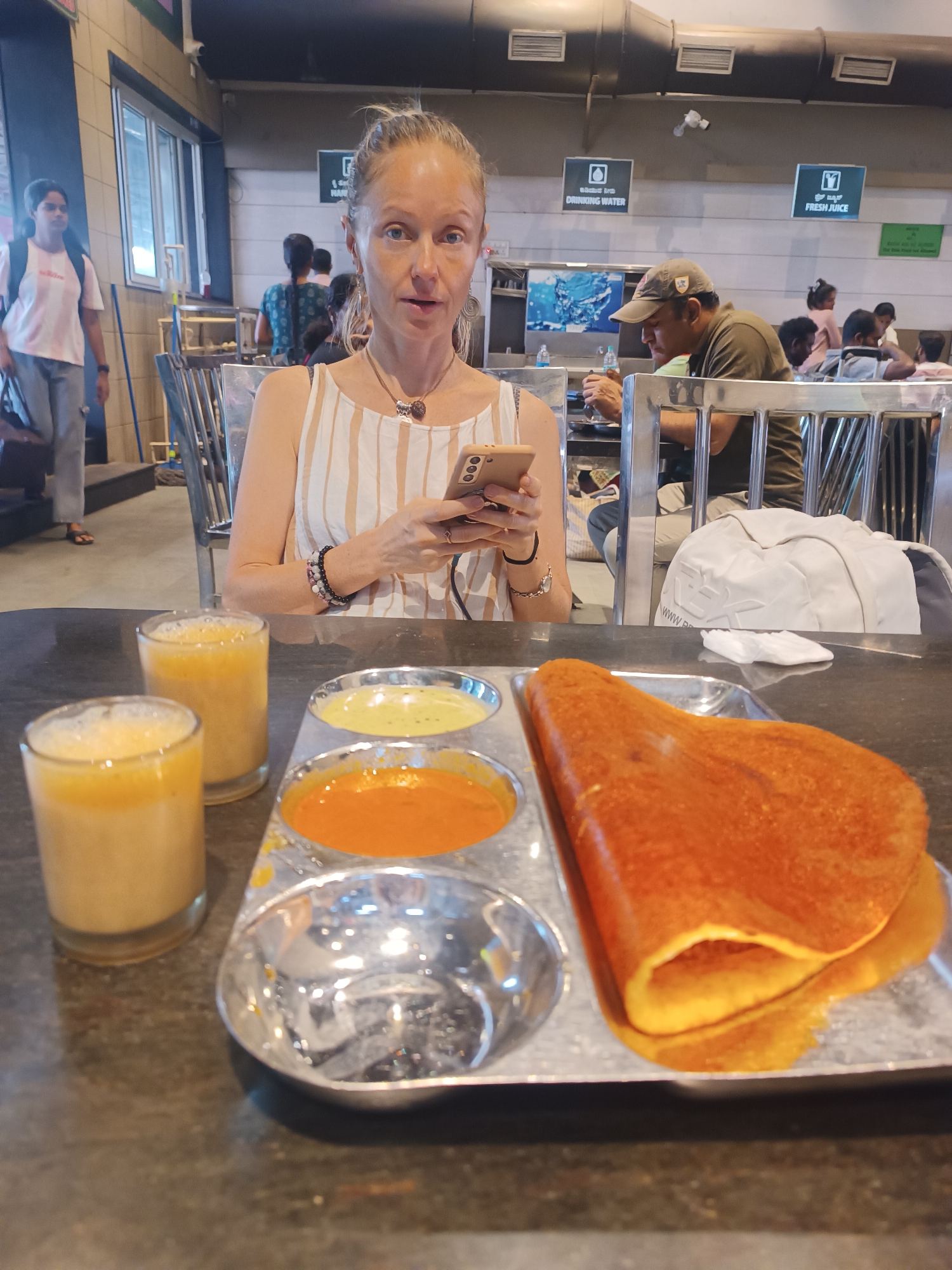 Woman photographed at restaurant table in Bengaluru