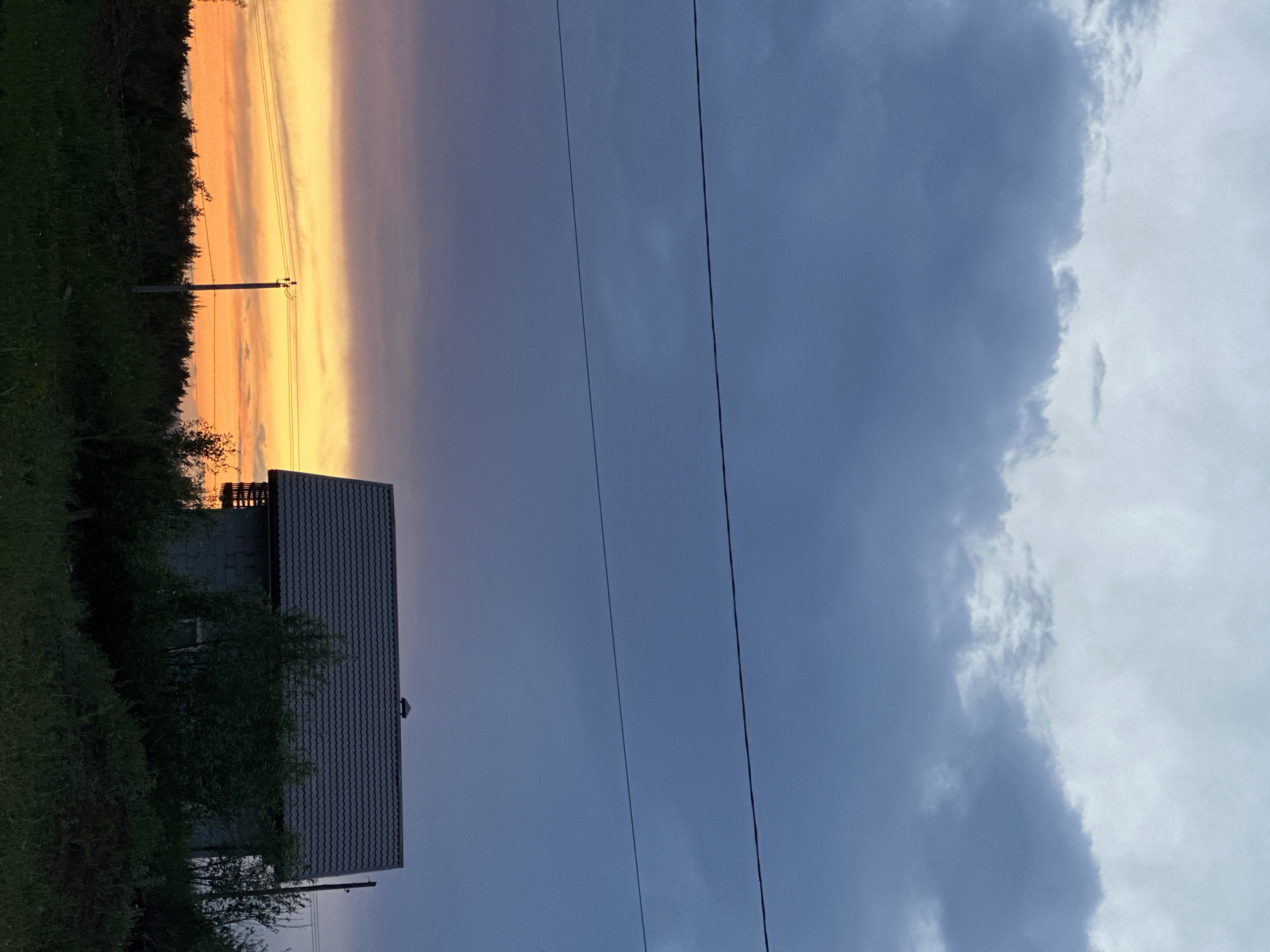 Sunset silhouettes house in Прикамский, Russia evening scene