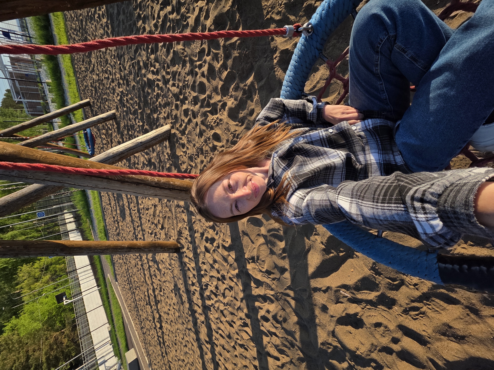 Woman enjoys sunset playground visit along Kama River in Russia