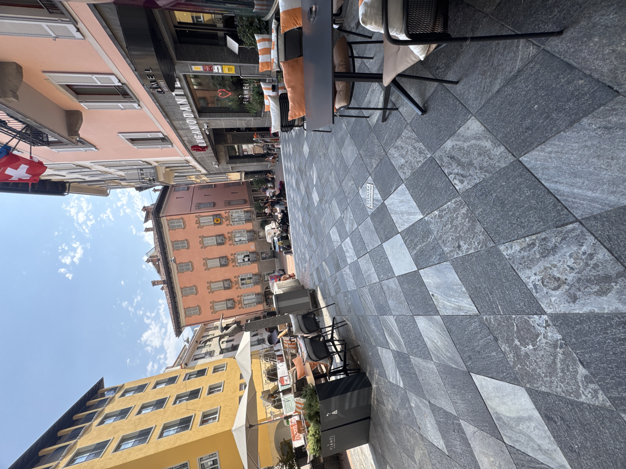 Strolling through Lugano's sunny pedestrian center on a summer morning