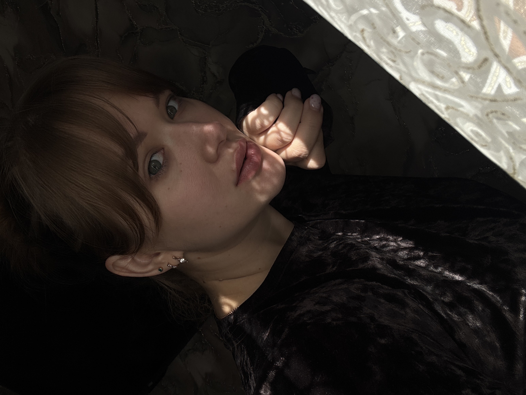 Back-to-back indoor selfies from Chaikovsky, Russia