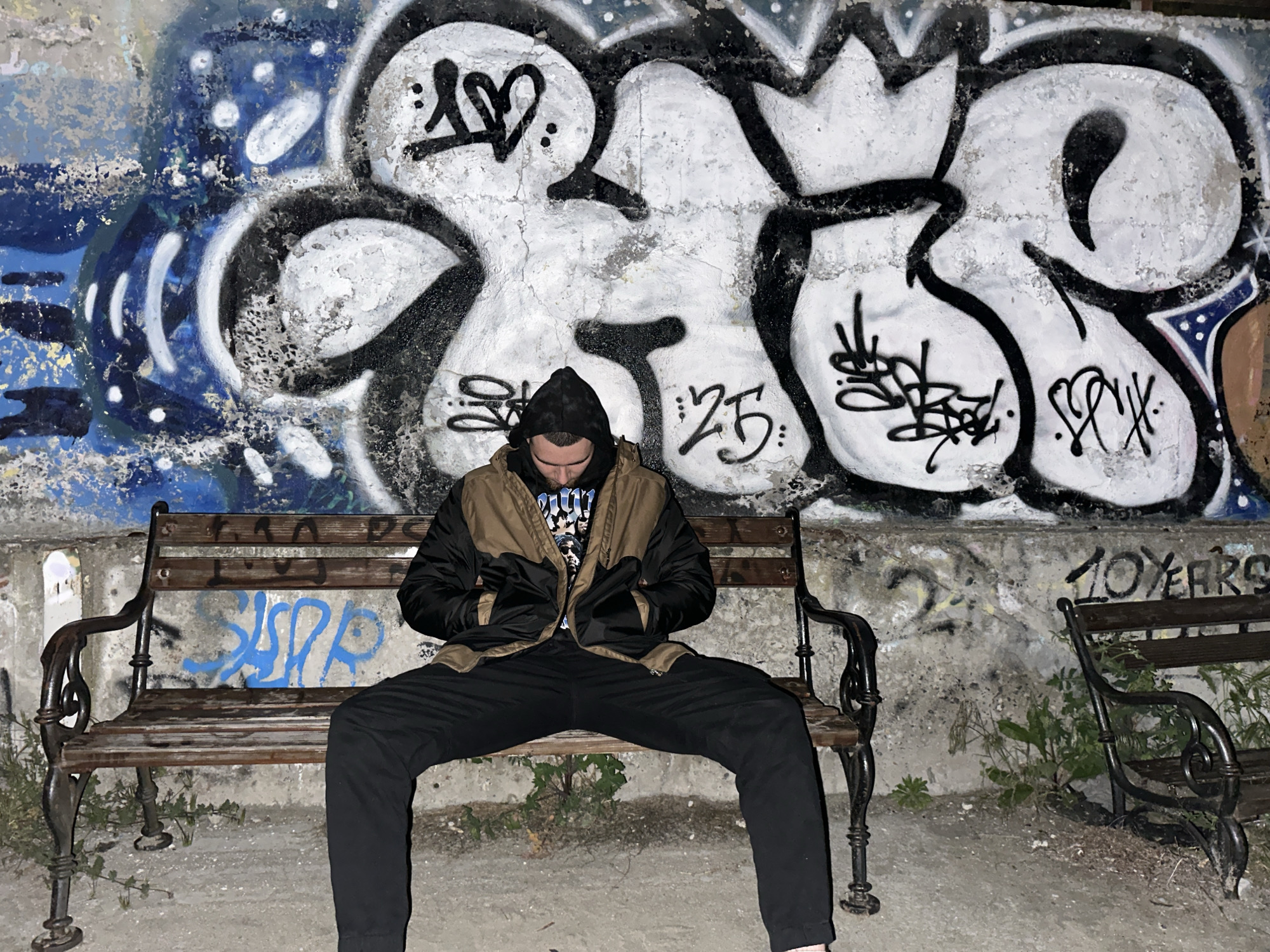 Solitary figure sits on bench in Burgas, Bulgaria