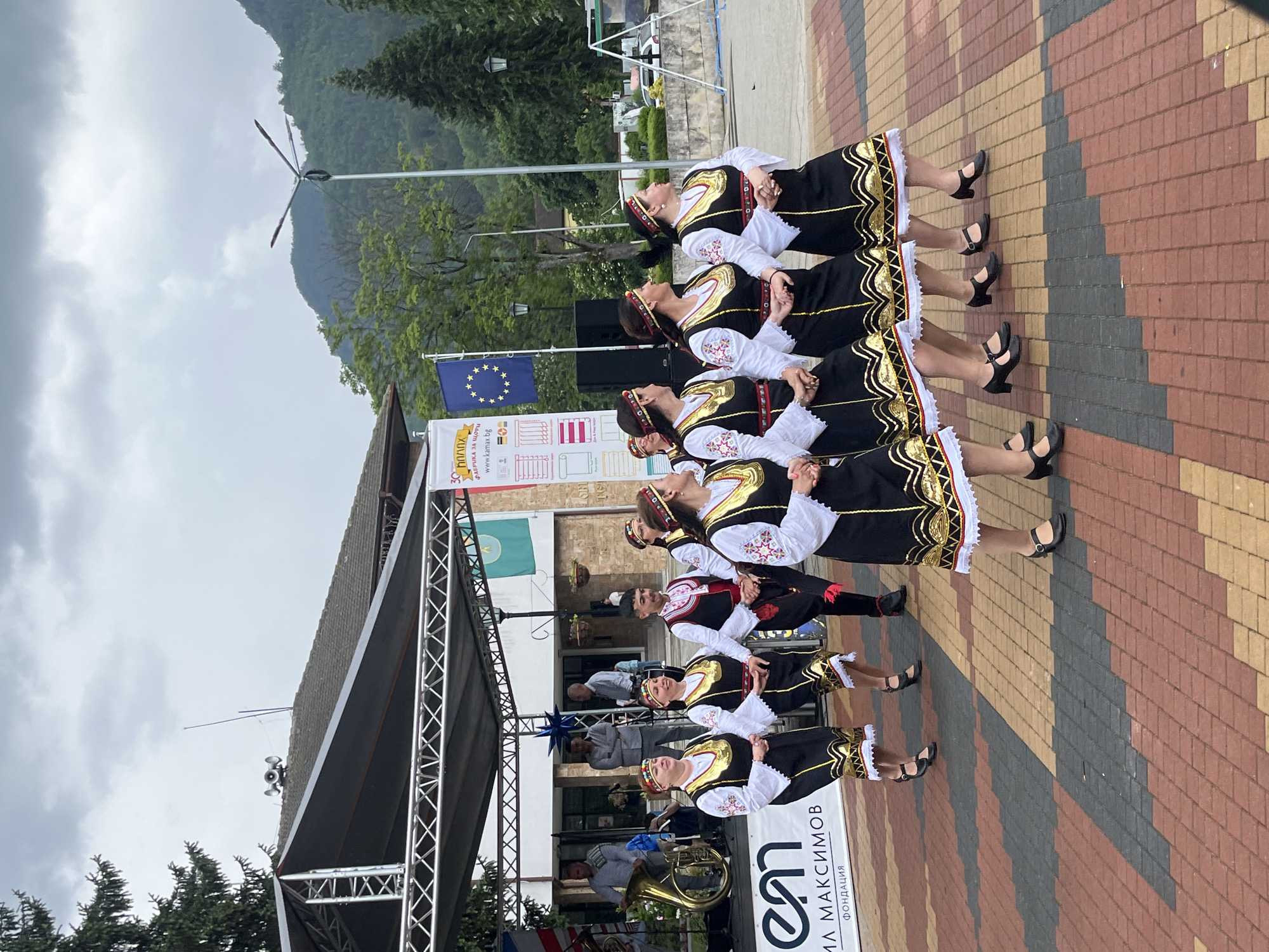 Traditional dance festival with market stalls documented in mountainous valley
