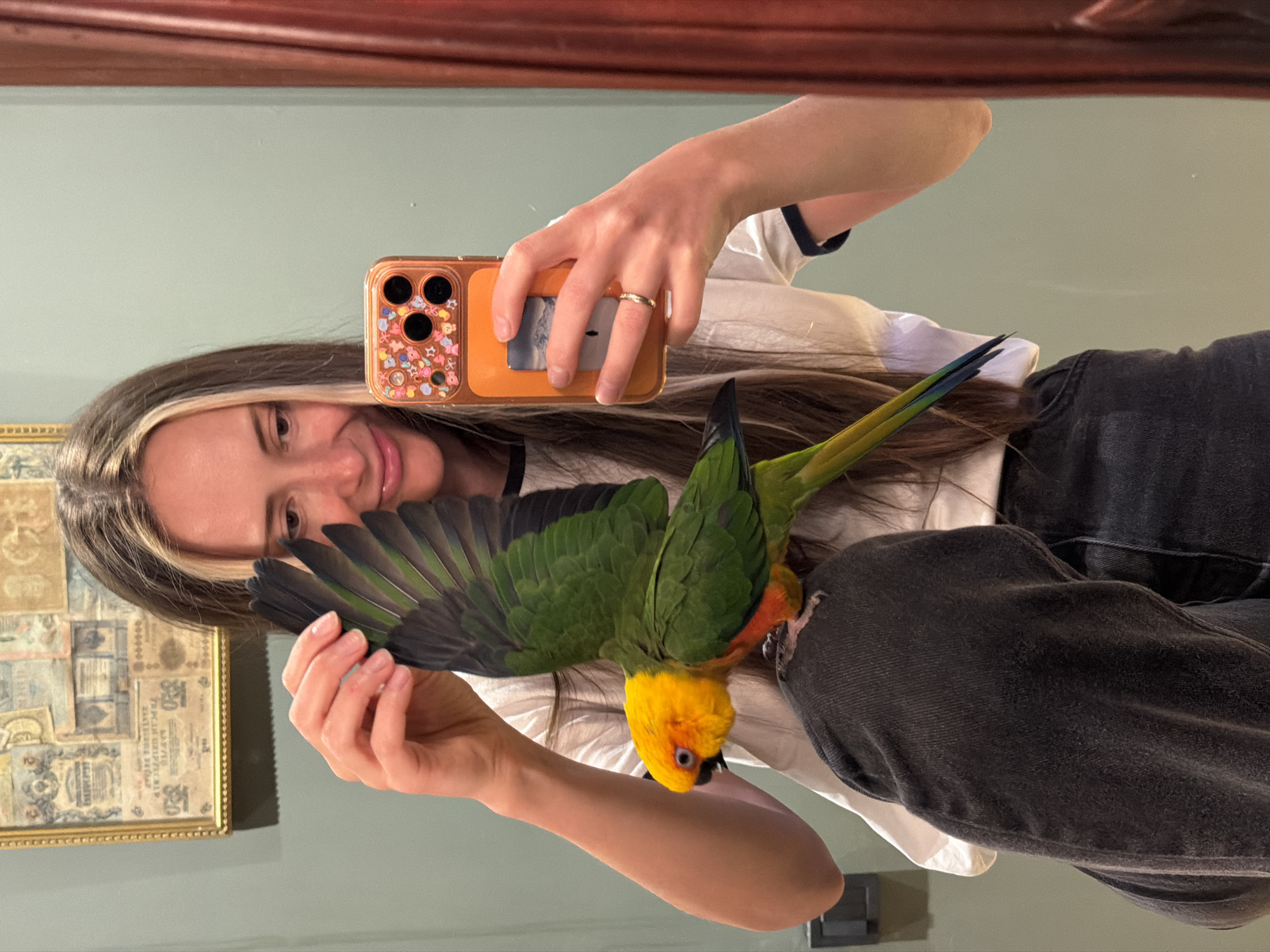 Woman documents spring afternoon with pet parrot in Khimki