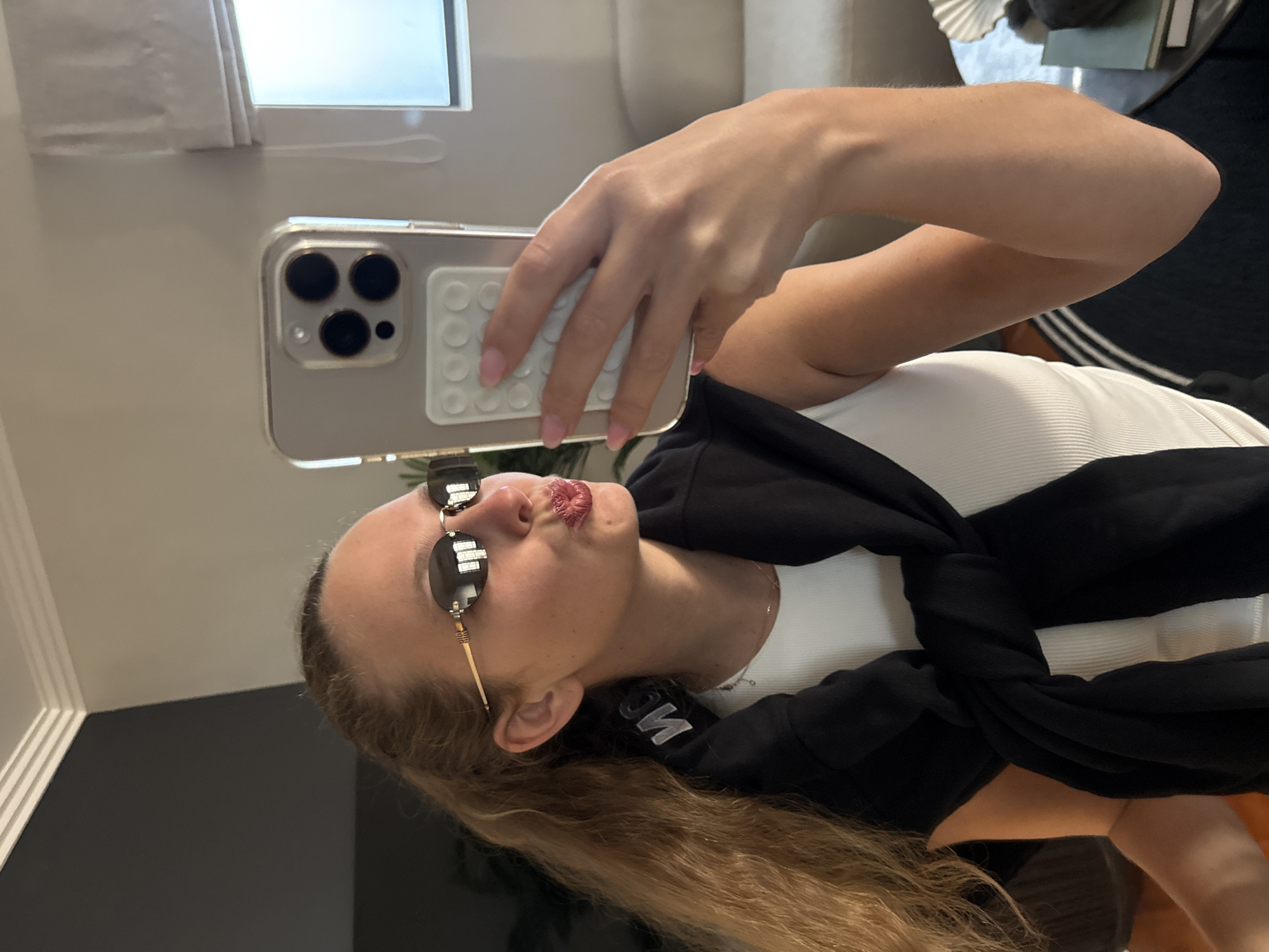Woman takes mirror selfies in Cape Town residence