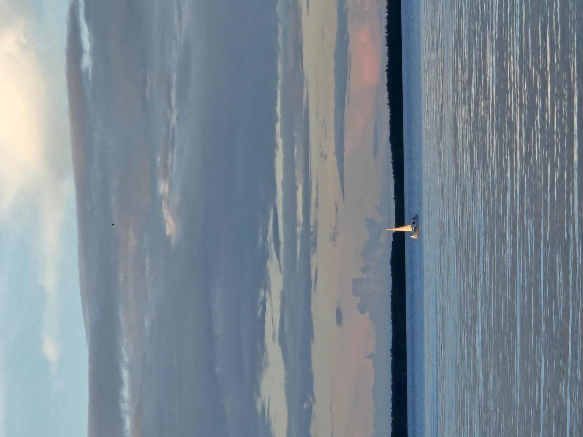 Calm waters and blue-domed churches at golden hour