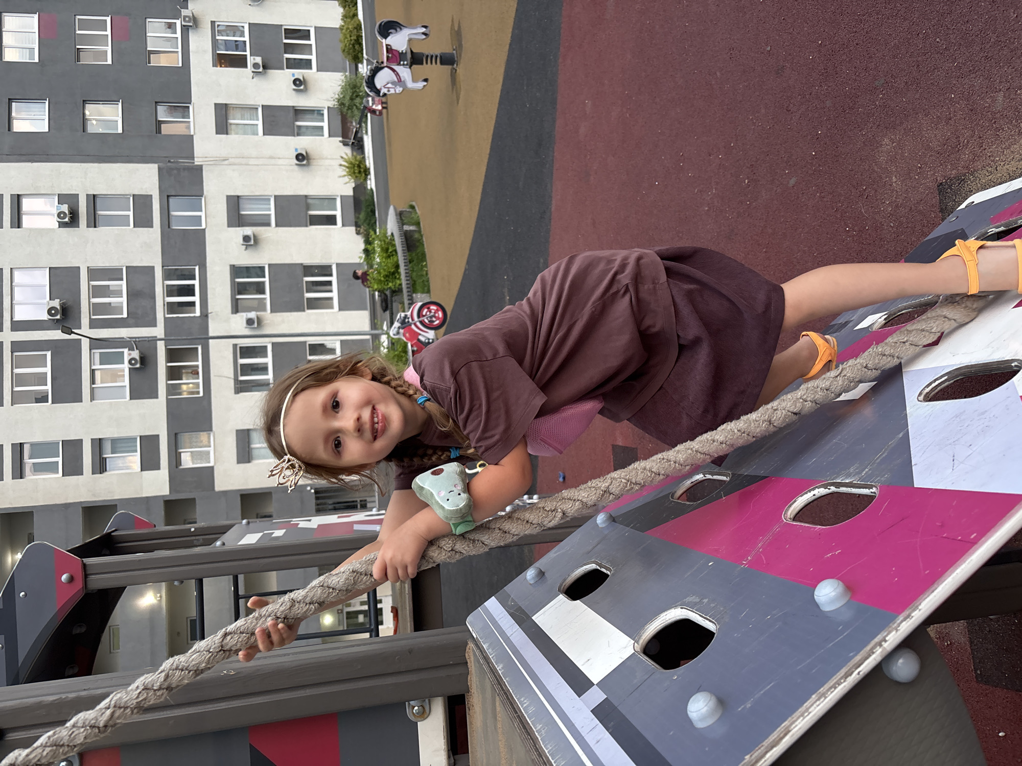 Rope climbing at an outdoor playground in Orenburg, Russia.
