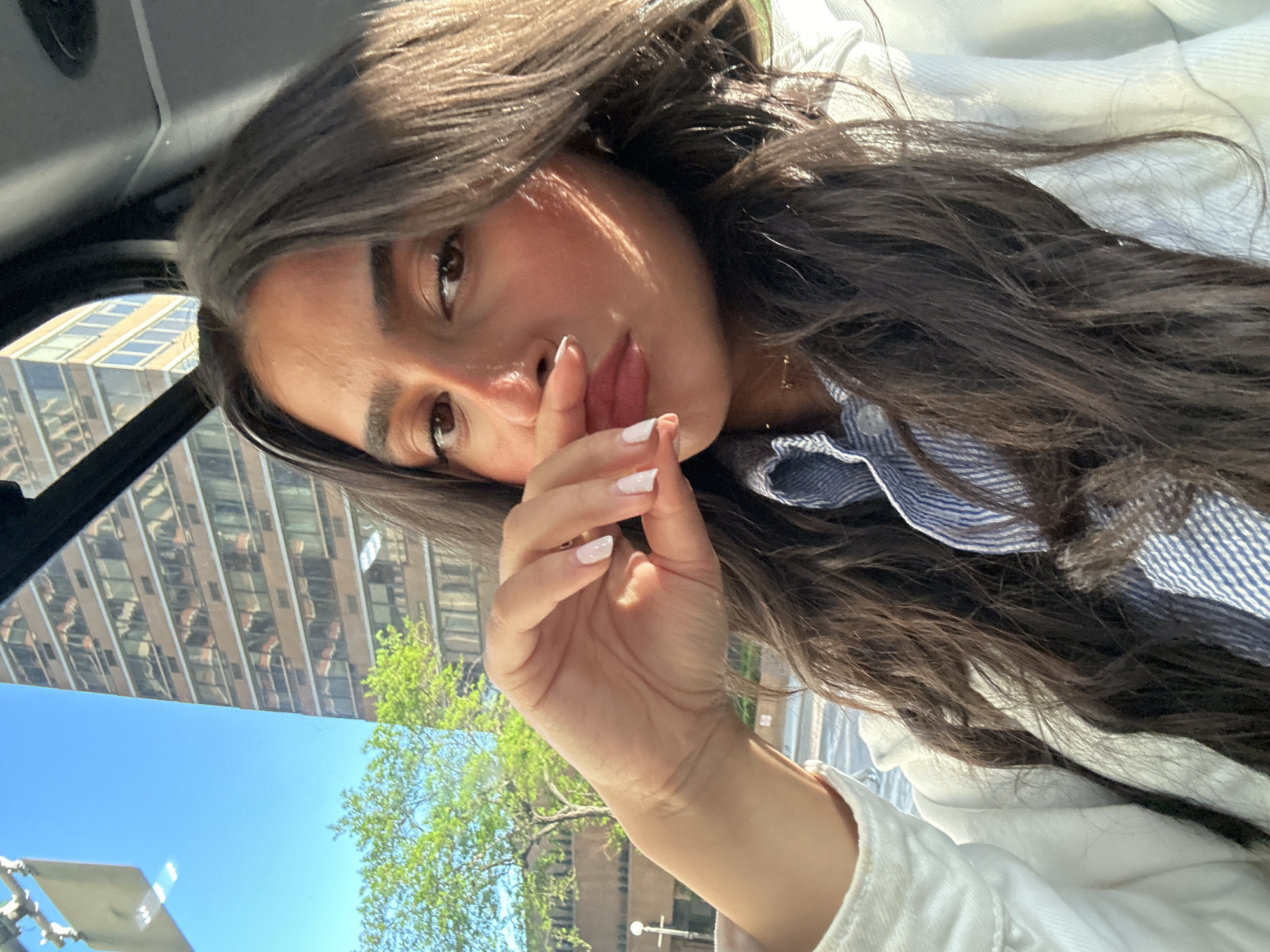 Woman observed in car near tall building in NYC