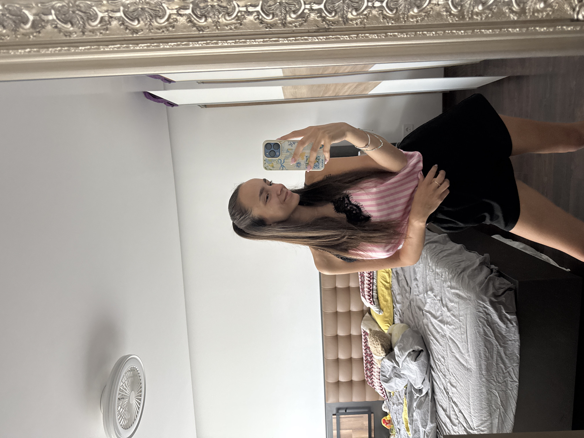 Bedroom mirror selfie in casual loungewear, Sofia